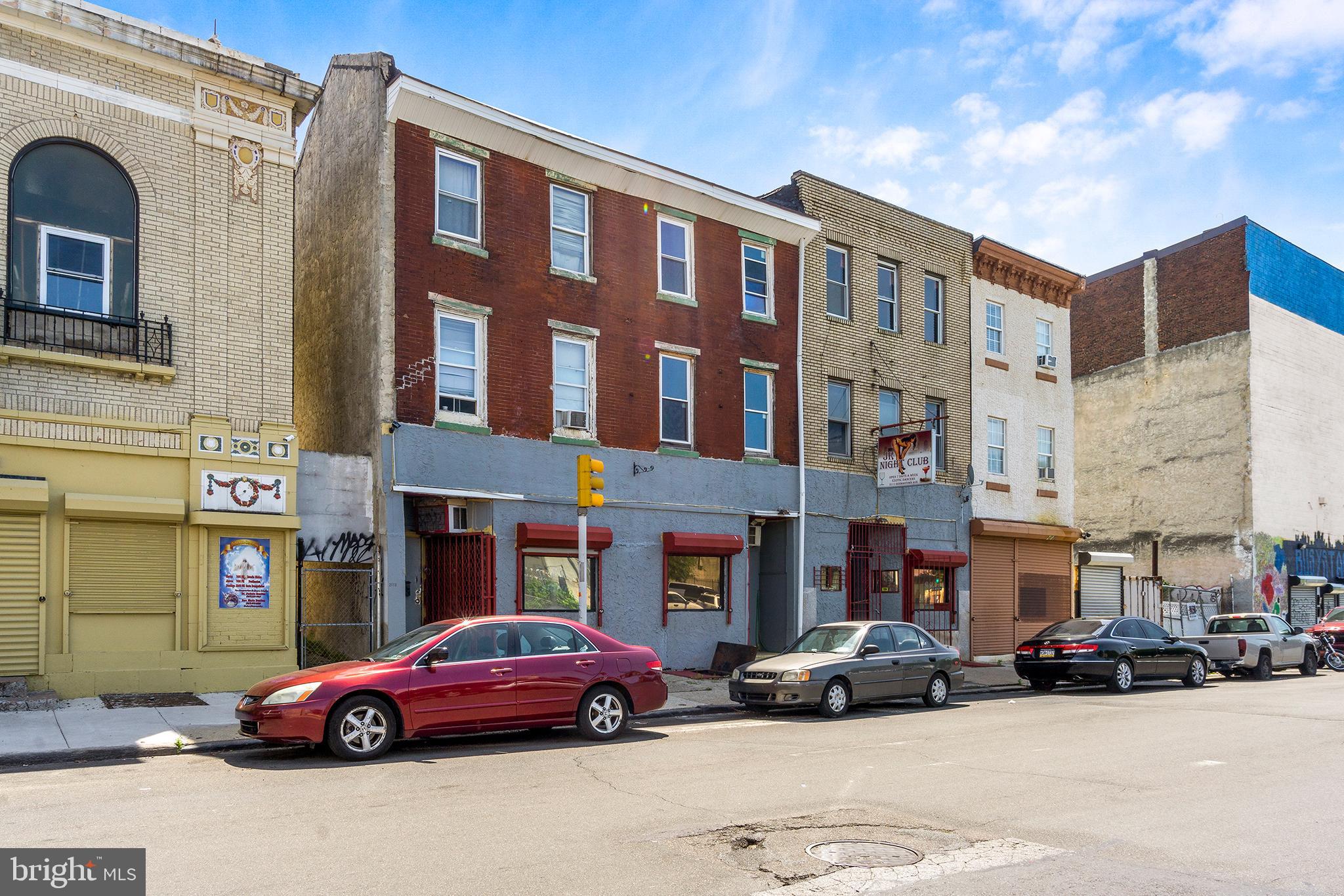 INCREDIBLE INVESTMENT OPPORTUNITY IN BOOMING OLD KENSINGTON! Nearly 10,000 square feet across two adjoining properties (2111, 2113-2115 Germantown Ave), all zoned CMX2 and brimming with redevelopment potential. This portfolio is being sold in as-is condition and presents a rare chance to own a substantial footprint in one of Philadelphia’s most rapidly transforming neighborhoods.
The first floors currently feature spacious commercial areas, formerly home to a restaurant, lounge, and full bar. With an open layout, high ceilings, and plenty of square footage to work with, these spaces are primed for a reimagining—whether as a hospitality venue, retail concept, or creative mixed-use hub. The seller prefers to sell with the liquor license, adding immediate value and flexibility, but is open to selling without it.
Above the commercial level, the 2nd and 3rd floors are configured as apartment units, providing a fantastic foundation for rental income or full-scale redevelopment into modern residential spaces. With two properties included in the sale, investors have endless opportunities—convert into multiple income-producing units, create a mixed-use development, or hold as part of a long-term investment strategy in a thriving market. Located just blocks from Temple University and surrounded by major new development, this location offers high visibility, strong foot traffic, and proximity to public transportation. Old Kensington has quickly become one of the city’s most desirable areas, blending historic charm with cutting-edge growth—making this a prime time to invest. Don’t miss this chance to secure a substantial property package with limitless upside in one of Philadelphia’s hottest neighborhoods!