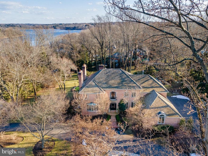 "Sleepy Hollow" one of the Great Estates overlooking the Springton Reservoir, is now available and awaits just one lucky home buyer. The approach to this gracious all brick estate home says it all, gated pillars, circular driveway, meticulous maintained irrigated landscaping and private corner home site offering water views. Revel in the many outdoor living spaces comprised of extensive hardscaped patios, terraces and verandas. Enjoy the custom gunite pool, hot tub, built in entertaining grill and spend hours sharpening your putting skills on your very own putting green. Exemplary stewardship, custom finishes and fine appointments are numerous throughout this lifestyle home. Notable interior hallmarks; welcoming curved staircase entry foyer, five masonry gas fireplaces, extended dining room, front to back formal and informal great rooms, magazine worthy fireside library encased in mahogany with custom built-in humidor and electronic shade system. Chef's kitchen off the glassed breakfast room features newer custom cabinetry, exotic high level countertops, Viking professional appliances, dual dishwashers, warming drawer, farm sink and prep sink, walk in pantry and ever popular built in  Miele coffee and espresso bar. Take in the sunset with a glass of wine from the fabulous vaulted sun room overlooking the outdoor retreat areas. The main living floor is complete with custom finished laundry room, two powder rooms, front and back staircases and oversized quality finished 3 car garage. Upstairs you will find a hotel inspired fireside primary retreat with extensive high end mahogany closet and dressing area ( unlike the library, this was worthy enough to be featured in a magazine), exquisite spa like bath with imported tiles, custom inset cabinetry and high end plumbing fixtures and cozy radiant heated flooring. Four additional generous sized bedrooms, 2 bedrooms serviced by a new and stylish hall bath and two ensuite bedrooms. A fabulous cedar closet and additional  finished closet space above garage complete the second level. An awesome day lit lower level completes this three story home and features a windowed gym with  full sauna, full bath, fireside great room,  full sized wet bar with dishwasher, refrigerator and more, billiard room featuring reclaimed wainscotting and moldings and  a home office /craft room complete this finely finished lower level. Stellar location, close to shopping and dining destinations in Newtown Sq., West Chester and the Main Line. Top-rated  Schools as well as close proximity to a number of highly regarded private schools. Convenient and easy commuting to Philadelphia and the PHL International airport. This is truly a spectacular retreat and must be seen to be fully appreciated.