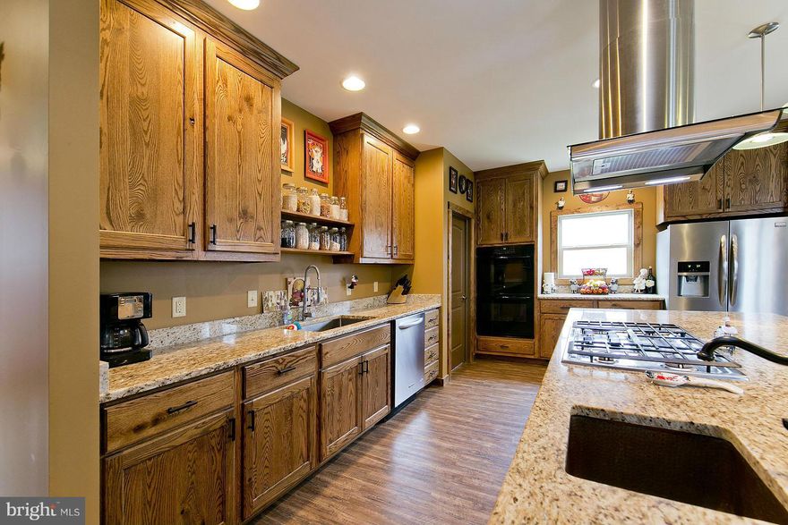 *Priced below recent appraisal* A custom home w/open concept living, kitchen, dining.  Huge theater/rec room.  Gourmet kitchen with custom oak cabinets, 10 ft island w/prep sink, double ovens, stainless appliances.  Master suite w/60in shower, double shower heads, oversized soaking tub.  2 zoned HVAC. 5 acres with great views.  Large shed conveys