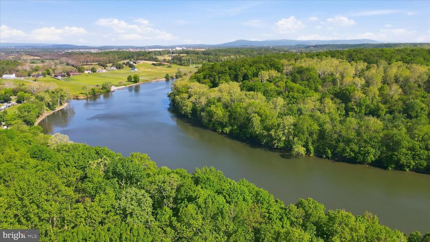 Discover a rare opportunity to own 23 acres of beautiful land on Carlyle Road in Martinsburg, just minutes from the charm and history of Shepherdstown.
This expansive property offers deep water access to the Potomac River, making it ideal for boating, fishing, kayaking, or simply enjoying the peaceful waterfront lifestyle. Parcels in this area are highly sought after for their combination of privacy, natural beauty, and proximity to town amenities.
Enjoy the best of both worlds—seclusion and convenience—with easy access to nearby shopping, dining, and commuter routes, while still feeling miles away from it all. Located within the greater Washington, DC commuter region, the property is approximately 53 miles from Washington Dulles International Airport — about a 1-hour drive depending on traffic. Martinsburg also offers MARC commuter rail service into Washington, DC, making the area increasingly attractive for commuters seeking space, privacy, and a more relaxed lifestyle outside Northern Virginia.
Whether you’re dreaming of building a custom home, creating a private retreat, or establishing a homestead in prime West Virginia land, this property delivers unmatched potential.