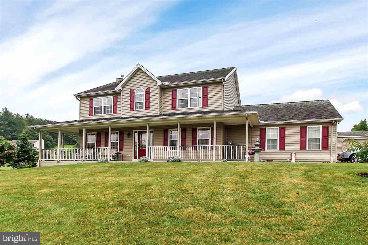 Beautiful country views! Come see this colonial-style home with generous room sizes, 2nd floor laundry and a large deck with retractable awning. Plus a recently installed retaining wall for a fully enclosed lawn space. Imagine the breezes and stunning views from your beautiful wrap around porch and the many gatherings that will occur in these amazing entertainment spaces. This over-sized lot is the perfect getaway for every day.