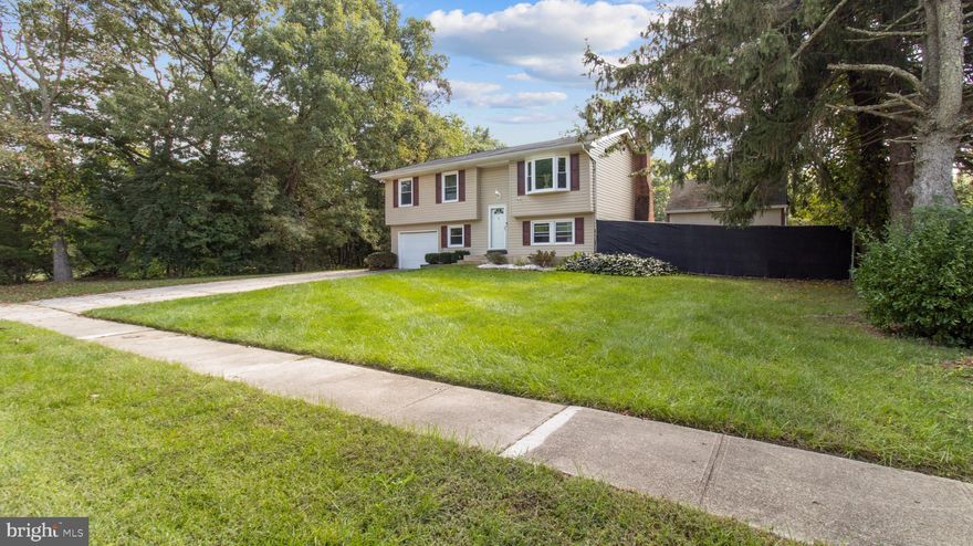 Discover the perfect blend of comfort and convenience in this delightful 3-bedroom, 2-full bath split-foyer home! Ideal for families seeking single-family living at the cost of a townhome, this property boasts a bright living room with a picturesque bay window that seamlessly flows into a cozy dining area, perfect for entertaining.

The kitchen features  stainless steel appliances and ample cabinet space, making meal preparation a breeze. Venture down to the inviting basement, where you’ll find a warm wood-burning fireplace and a recently updated full bath showcasing a spa-like shower. This versatile space includes a separate area that can be easily closed off—currently serving as a home office.  Offering endless potential this basement can easily converted to be an in-law suite or a studio apartment for rental income!  Additionally it  also features elegant French doors that leads you to the large open fenced in backyard fitted with a paved patio ready for those cookouts!

Conveniently located near local shopping, including grocery stores and a mall, along with several popular eateries, this home is perfectly situated for a vibrant lifestyle. Don’t miss the opportunity to make this charming home yours just in time for the holidays!