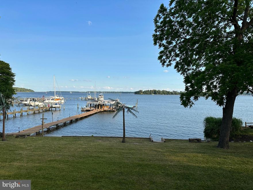 ***Major Price Reduction***Once in a lifetime opportunity to own this entertainers paradise with panoramic views of the Magothy River and Dobbins Island and Little island, over 1 acre of level land with a sandy beach, 6500 sq. ft. contemporary style main home with gorgeous water views from almost all rooms including  bedrooms with patio and deck access, unimaginable movie theater wing featuring custom lighting,  a wet bar with beer taps, refrigerator, multiple high top tables, massaging recliners and theater seating, private half bath, interior and exterior entry's, it even has a ticket booth, candy display and popcorn machine to add to the experience, the large primary suite overlooking the level yard and water,  with access to huge decking with hot tub/spa, suite also featuring fireplace, dressing area, double vanities,  private water closet w/bidet, whirlpool tub, separate shower with multiple body jets,  and heads, the house has an abundance of natural light with vaulted ceiling and skylights throughout, enjoy breathtaking water views from your kitchen, great room w/fireplace and private glass office with built ins, wet bar etc.  two separate staircases lead to the spacious recreation room, family room w/fireplace, granite bar, with sink and mini fridge,  3 bedrooms and full bath with jetted tub all adjoining the patio, huge yard and water views,  concrete golf cart path leading to a pier that cannot be replicated the main portion is 8' wide x 162' then it spreads out to approx. 50 x 20 w/covered tiki bar with double bar w/sink, electric, grilling area, plus covered slip, with built-in crab slough box with pump,  this leads to two additional finger piers with 2 boat lifts, 2 PWC lifts, and floating heated swimming pool that was permitted from AA county,  this property offers so many possibilities for multi-generational living or income-producing from the approx. 1200 sq. ft. 2 story separate guest house featuring 1 bedroom, 1.5 baths, a small balcony, and a 576 sq. ft. 32 long garage for limo, boats, watercraft, golf carts, etc.  Must be prequalified and or have proof of funds to schedule a showing. Estate Sale exempt from Disclosure/Disclaimer Appraisers note: As per estate home was sold as is with no inspections.