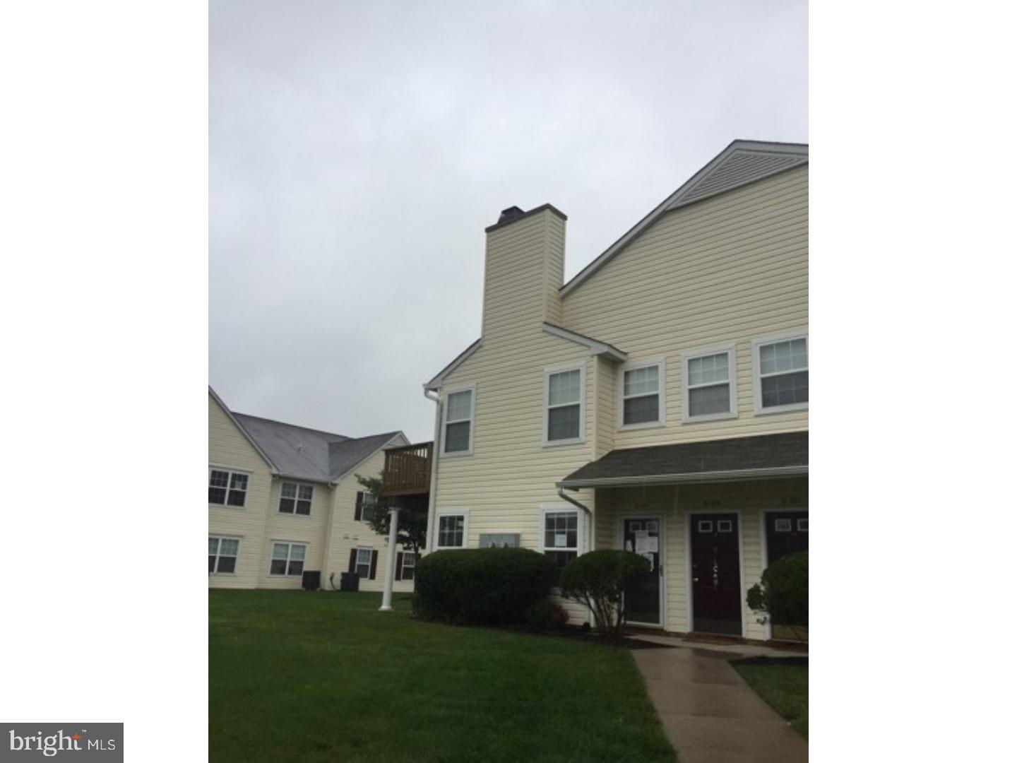 Lovely first floor condo with many upgrades, including hardwood floors in the living room and dining room, with fireplace and slider to a small patio.