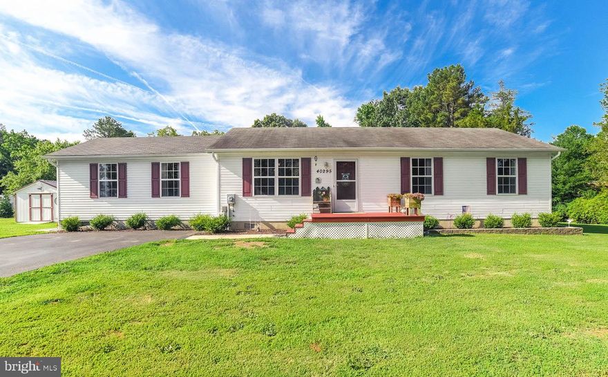 Nice Rambler nestled on a private 3/4 acre lot that backs to trees! Featuring 4 TOTAL bedrooms and 3 total FULL baths. (TWO MASTER BEDROOMS each with their own attached baths.)  Spacious country kitchen with  side-by side refrigerator, smooth surface stove, built-in microwave, dishwasher, pantry and lots of cabinet space.  Kitchen eat-in dining space with glass sliding door leading to a large entertainment deck.  Living Room with cozy carpet is great for enjoying family time.  Master Bedroom #1 offers lots of space (24' x 19' - including it's walk-in closet and attached bath) and also features wood laminate floors, crown molding and ceiling fan.  Attached master bath #1 boasts a linen closet, shower/tub combo and a nice vanity.  2nd Master Bedroom offers an attached bath with tub/shower combo, ceiling fan and wood laminate floors.  3rd and 4th bedrooms with ceiling fans, bright windows and wood laminate floors.  Updated hall/guest full bathroom with a beautiful vanity with storage space. Laundry room with washer and dryer.  Enjoy the large backyard featuring a tree/playhouse (6'7" x 9'8" tall) and HUGE deck (28 x 20) that's prepped for a hot tub and great for BBQ'ing.  Pergola with cover on deck offers shade on hot sunny days! Large 12 x 16 metal roof shed with electric!  Extended paved driveway for extra parking space.  Offering great space and charm inside and out...this home is waiting just for you! A MUST SEE!