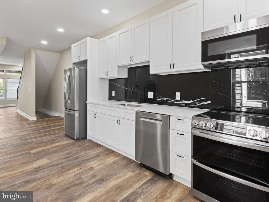 Welcome to 2903 Winchester Street, a beautifully renovated 4-bedroom, 3-bathroom home nestled on the west side of Baltimore that perfectly blends modern comfort with classic city charm. This warm and inviting residence features an open floor concept that creates a seamless flow between the living, dining, and kitchen areas—ideal for both everyday living and entertaining. Luxury vinyl plank (LVP) flooring runs throughout the home, adding durability, style, and a cohesive, contemporary feel to every space.

The heart of the home is the stunning kitchen, complete with sleek stainless steel appliances, ample cabinetry, and modern finishes that make cooking and gathering a true pleasure. Just off the rear of the home, step onto a spacious 200-square-foot deck, perfect for outdoor dining, relaxing, or hosting friends and family. The private fenced backyard offers a cozy retreat for kids, pets, or quiet evenings, while the included washer and dryer add everyday convenience and ease to your lifestyle.

Upstairs, the generously sized master bedroom serves as a peaceful sanctuary, featuring its own private en-suite bathroom designed with comfort and style in mind. With three full bathrooms, this home provides flexibility and functionality for families of all sizes. Thoughtfully renovated from top to bottom, this cozy yet modern property is move-in ready and ideal for a family looking to enjoy the character, community, and charm of Baltimore City—while still enjoying all the amenities of a beautifully updated home.