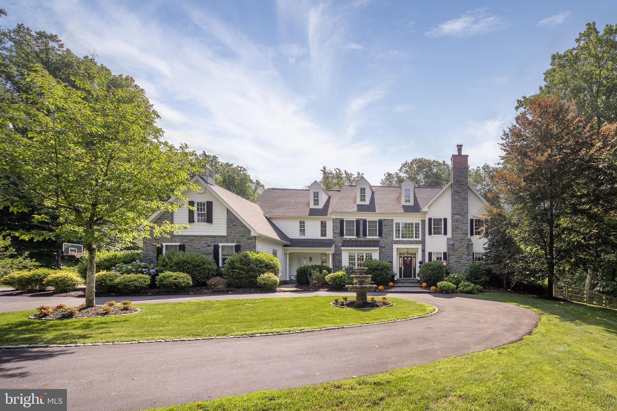 Scenic byways abound in the heart of Chadds Ford, known for its expansive tree line views, yet just close enough to the highway ... 23 miles from Philadelphia.
Your journey leads to the circular driveway where you first meet your beautiful new residence at 90 Atwater Road. Situated on 2.65 acres nestled in nature you'll enjoy privacy and a sense of place within the neighborhood of Stonebrook.
Three steps inside you notice the modern-tradition design as natural light abounds. The architectural details in the custom millwork and curved archways, plus the hardwood floors that reflect the natural light catch your eye as you meander between the open dining room and living space to your new corner office, tucked in the back of the house with built-in bookcases .
At the center of it all is the fabulous chef's kitchen featuring top of the line appliances, a huge island, expansive soft white and gray cabinetry and a coffee bar station. Gather around the table in the breakfast room or step outside for dinner under the stars on the deck, and dessert around the fire pit on the patio below.
Gathering has new meaning as everyone calls their spot on your dream sofa in the family room. This is the heart of home.
With a three car attached garage, plus another adjoining two car garage, there is room for everything from cars to bikes to skis and skates. Perhaps you create a home gym or enjoy watching the kids practice free shots from your cozy grandstand with the doors up before calling it a night.
As the day winds down, it's time to head up the back staircase to the second floor that features five spacious bedrooms and 4 full baths. The gorgeous primary bedroom features a lounge room and ensuite with two vanities, soaking tub and shower. There is another bedroom suite with full bath at the opposite side that is ideal for a second level playroom or guest room. A full laundry room completes this floor.
This special move-in ready home also has a full finished basement with daylight windows and sliding doors to walk out to the patio and backyard.
From Super Bowl parties to movie night in your private theater room, this space is for entertaining! This level also includes a sauna and full bath, plus plenty of storage space.
Say yes to this address. Your forever destination at 90 Atwater Drive, Chadds Ford.