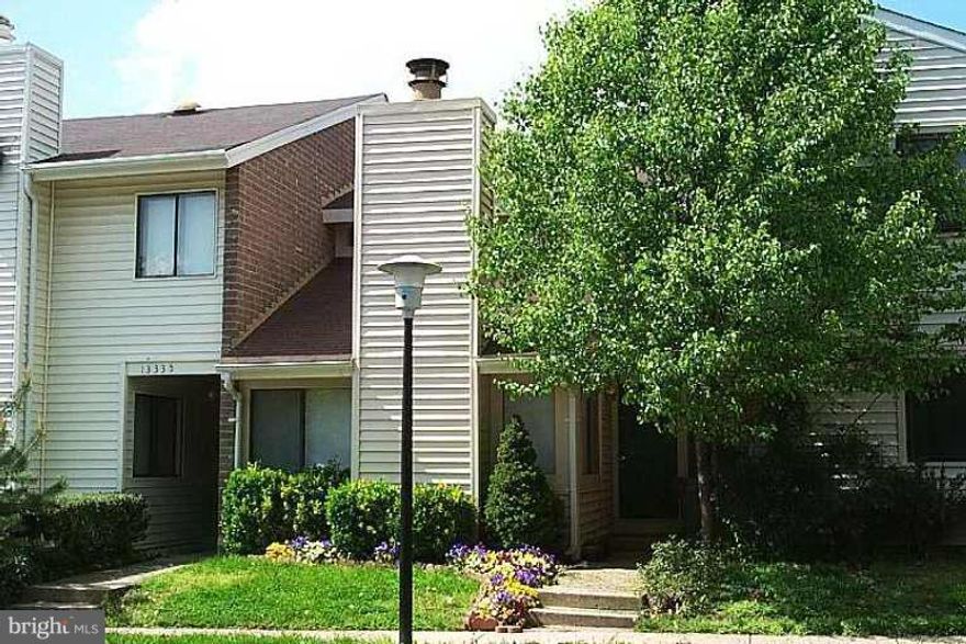 Brand new paint and flooring throughout! Updated, new vanity in full bath. Light and airy with vaulted ceiling. Private, fenced backyard with storage shed. Wood burning fireplace! Walk to elementary school and shopping center! Quick access to Dulles Toll Rd.