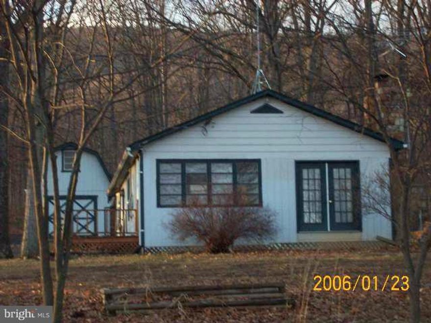 Great Opportunity!!  2br. 1ba. Rancher surely needs some serious improvements & repair, but at this price the end results could be VERY Good! Great Corner Lot with a nice 2 story outbuilding. Perfect for the Investor or Renovation loans. Sold AS-IS  Only 15 minutes to Downtown Winchester. Cool Mountain/Lake Community. Ask about the Home Warranty.