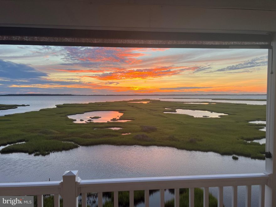 CAPTIVATING WATER VIEWS! Nestled in midtown, this condo offers a spacious balcony, perfect for unwinding and capturing mesmerizing sunsets. This property shows pride of ownership and has never been used as a rental. Recent updates within the last few years comprise of 3 new mini- split HVAC units,  new slider doors, new carpet, new washer and dryer, new water heater, new dishwasher, and newly installed vinyl balcony railings. The primary bedroom features a convenient half bath and direct balcony access. The kitchen showcases coastal-inspired white cabinetry, granite counters, and a welcoming counter bar. A designated storage closet is available for your beach chairs. The condo fee is remarkably budget-friendly, at just $1,300 per year! ALL OFFERS due Sunday at 5pm.