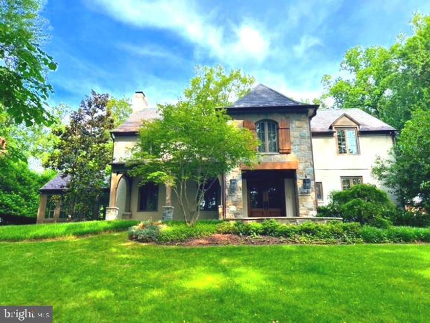 Discover refined living at 8820 Burning Tree Road, a spacious 6-bedroom residence in the heart of Bethesda, MD. Set on over an acre of meticulously landscaped grounds, this home seamlessly blends luxury with everyday comfort, offering both grand entertaining spaces and intimate retreats. Step inside to find a thoughtfully designed layout, where an airy open-concept kitchen and family room create an inviting hub for daily life, while formal living and dining rooms provide an elegant backdrop for special occasions. The main level also includes a private office and a sunlit sunroom, perfect for relaxing with a book or enjoying morning coffee. Upstairs, the generous primary suite serves as a peaceful sanctuary, complemented by three additional bedrooms, a versatile second office/nursery, and three well-appointed bathrooms. The finished lower level adds even more flexibility with a spacious recreation room and a full bathroom—ideal for movie nights, a home gym, or guest accommodations. Outside, the expansive flagstone patio transitions to a sprawling, manicured yard, offering endless possibilities for outdoor gatherings or quiet enjoyment. A detached two-car garage completes the property, topped by a charming guest suite complete with a kitchenette—perfect for visitors or extended family. Combining privacy, sophistication, and a prime Bethesda location, this exceptional home is designed for those who appreciate both space and style.