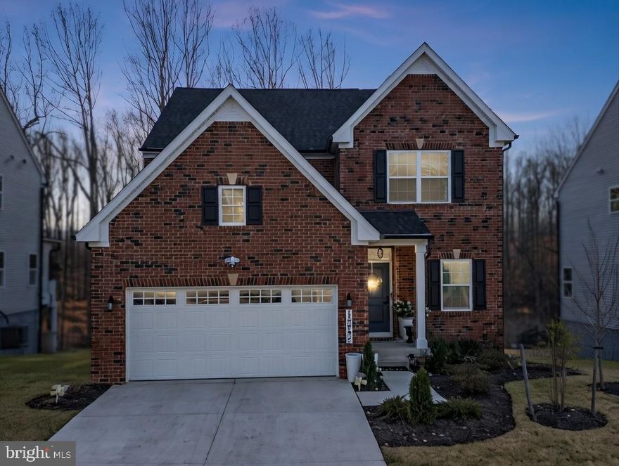 *Open House This SUNDAY  01-18 (12 PM- 2PM) ****. Welcome to 15542 Twin River Circle — a fresh, modern vibe in the heart of Bowie’s amenity‑crazy South Lake community. Just built in 2025 (less than a year new!), this home hits the sweet spot: designed for the way you actually live. Backed by lush greenery for added privacy, the home is filled with beautiful natural light and the premium lot features a gorgeous deck, patio, and fencing—perfect for morning coffee, sunset dinners, or low‑key entertaining with a view.  Inside, the popular Ballenger model welcomes you with a covered front porch and a flexible main‑level space that works perfectly as a home office, creative studio, playroom, or stylish sitting area. The open‑concept kitchen steals the show with a large modern island that flows effortlessly into the dining area and family room—ideal for hosting, relaxing, or everyday living.  Upstairs, the owner’s suite is a true retreat, complete with two spacious walk‑in closets and a calming layout designed for comfort. 3 additional spacious bedrooms are on the upper level as well as a laundry room. The finished basement features a 3rd full bathroom and offers the potential for a fifth bedroom and wet bar—game nights, guests, or movie marathons made easy.  This thoughtfully designed home offers 4 bedrooms, 3.5 baths, over 3,300+ sq. ft. of finished living space, and a two‑car garage, all set on a beautifully sized lot.  And the lifestyle? That’s where South Lake really shines. This is a cool, new master‑planned community right off Route 3 with town‑center vibes and everything at your doorstep—marketplace shopping, restaurants, banks, community pool, community center, scenic trails, parks, and more—all within walking distance. Plus, commuters will love the easy access to Routes 301 and 50, making daily travel a breeze.