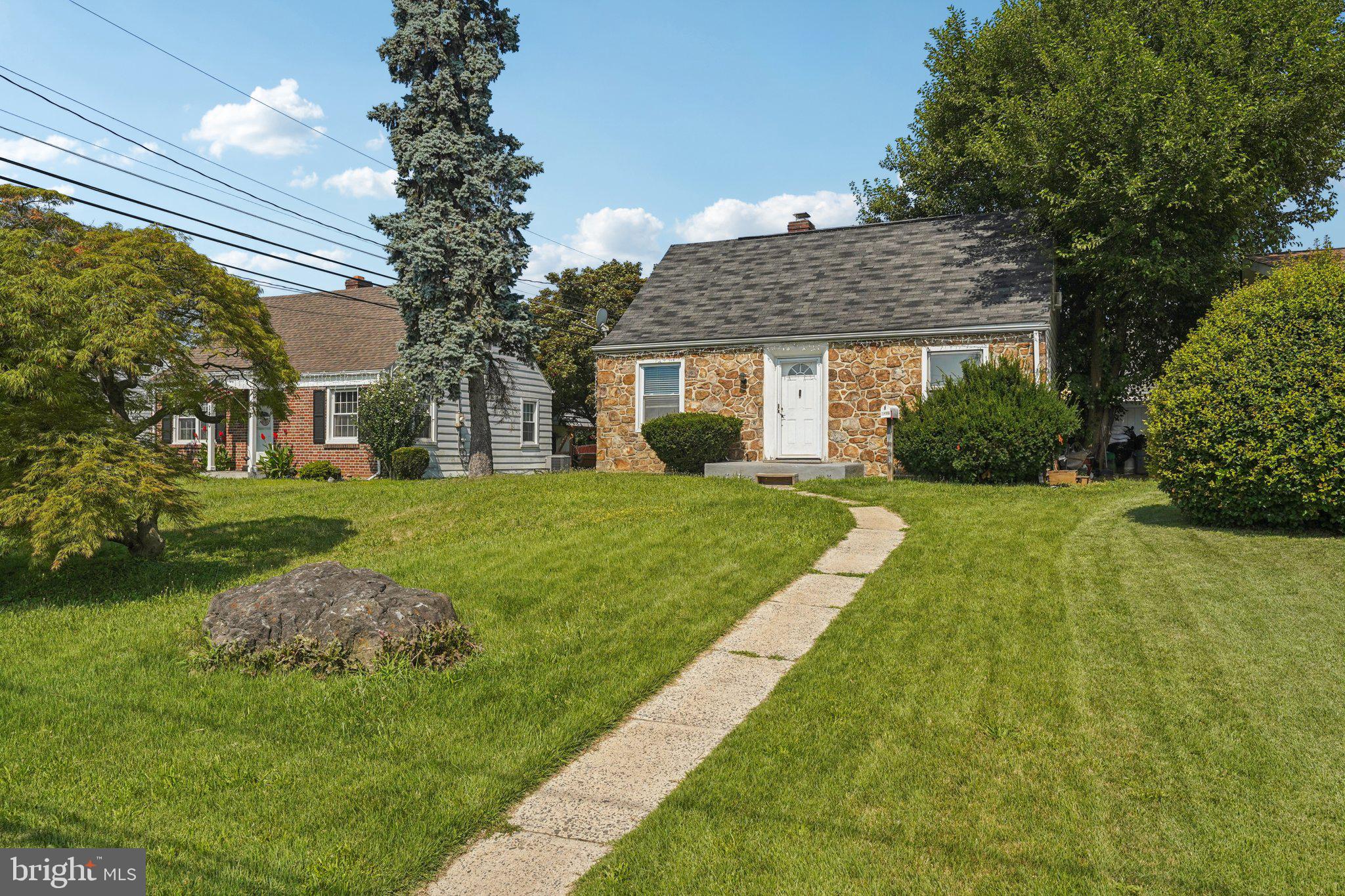 Welcome to this well-maintained Cape Cod-style home, where the main floor is bathed in natural light, creating a warm and inviting atmosphere from the moment you enter. A spacious living room with large picture windows lead into the eat-in kitchen with a breakfast nook and stainless steel appliances. Just off the kitchen, a functional mudroom leads to a stunning sunroom that overlooks the fully fenced backyard, complete with a patio and ground-level deck. Whether you're seeking a sunny playroom or serene home office, this versatile space has endless potential. The main level also features a generously sized primary bedroom, a second bedroom currently used as an expansive walk-in closet, and a full hall bathroom. Upstairs, a charming sitting area leads to a private third bedroom. The finished basement offers incredible flexibility with additional rooms that can serve as bedrooms, home offices, hobby areas, or whatever suits your lifestyle. A convenient half bathroom and laundry room complete this level. Don’t miss your chance to own this inviting and versatile Cape Cod gem!