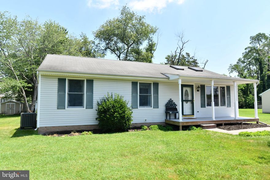 Relax on your front porch or your back decking, overlooking the open & level back yard with plenty of room for outdoor activities! This three bedroom rambler offers ideal main level living PLUS a lovely finished lower level! Updated eat-in kitchen boasts some stainless steel appliances, granite countertops & custom, soft-close maple cabinetry with pull-out drawers and built-in "pantry"! Decorative "fireplace" is focal point for the light and bright living room with two skylights.  Even the baths have been nicely upgraded.  Brand new carpet has JUST been installed! Expansive recreation room in the full basement with great LVP flooring and pellet stove, plus a huge cedar closet and a terrific workshop, with one of workbenches (the one in the middle) to stay.  Convenient walk-up exit to the backyard from the storage area! HVAC was replaced in 2024, inside and out! Two sheds, one with a subpanel and 240 electric! Minutes to Old Town Manassas & VA Rail Express!