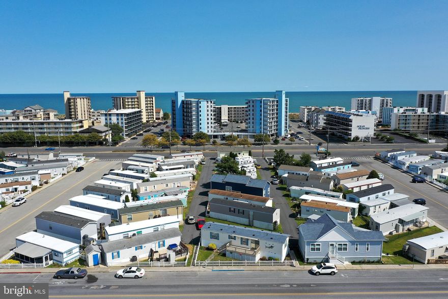 This 2BR, 1.5BA beach retreat has everything you need to enjoy the beach lifestyle.  Located in Ocean City, you are just a couple blocks to the sand.  The Sundowner Park community has a pool to enjoy when you want a break from the beach.  Turn-key and ready for your immediate enjoyment.  Fenced in yard with maintenance free, covered porch to enjoy your morning coffee or afternoon cocktail and parking right out front of your house.  No condo fees or land rent.  Low co-op fees include amenities, lawn care, management, water, sewer and trash.