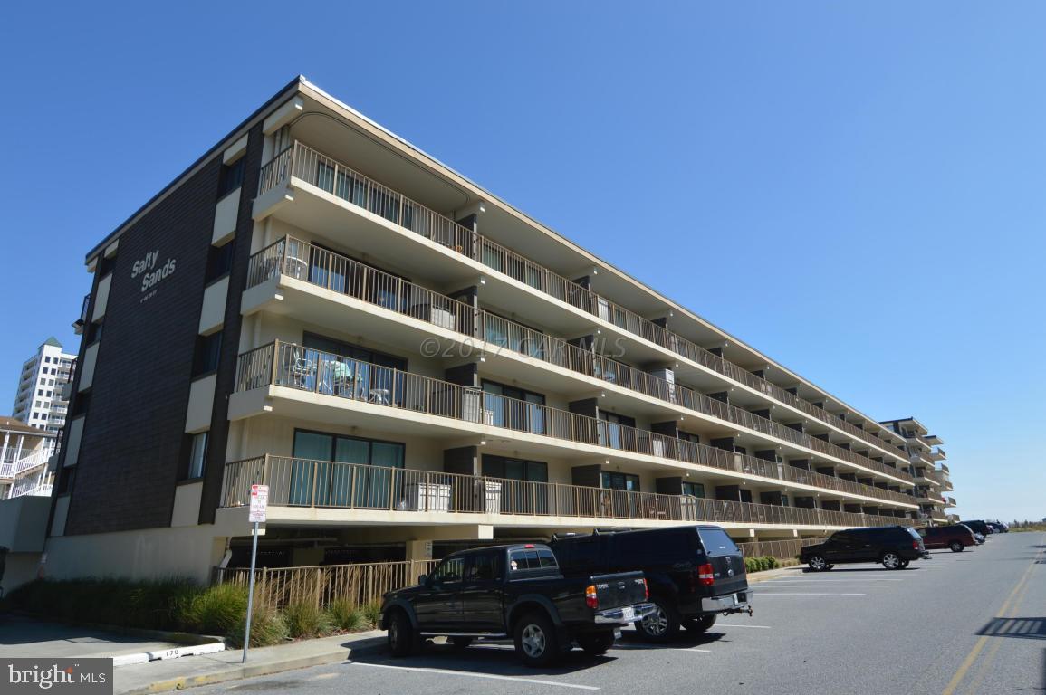 This unit is in excellent condition. Never rented, end unit for additional lighting and views of the bay and ocean. Newer appliances and 2 covered parking spaces (124 & 125) One year warranty conveys to buyer at time of settlement.