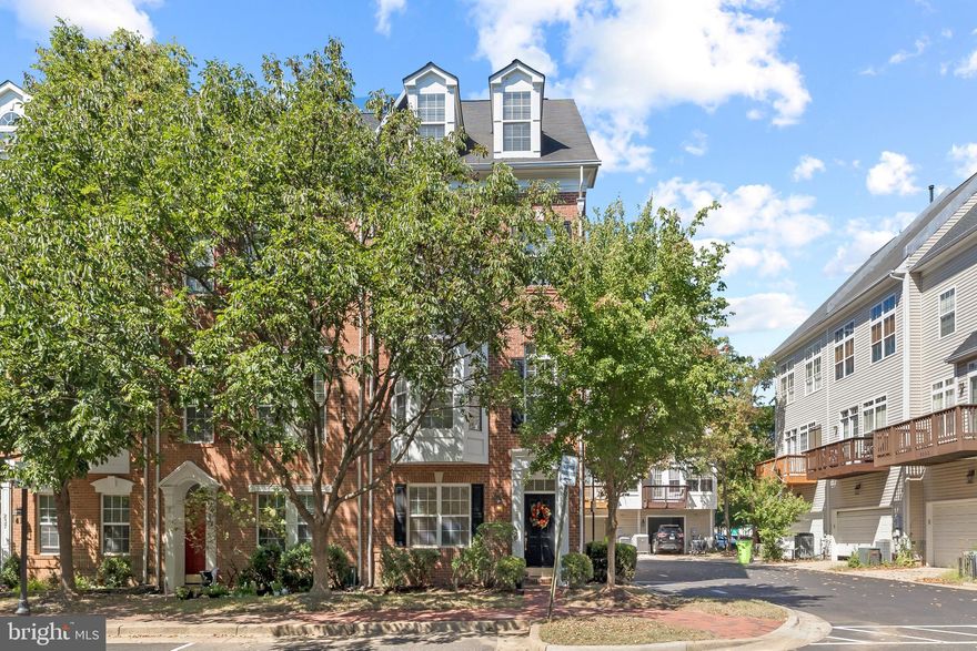 Nestled in a prime location, this sun-drenched end unit Bradley model is just minutes away from the community amenities and the serene Brenman Park. This spacious townhome boasts 4 levels, featuring 3 bedrooms and 3.5 baths and two car garage. Hardwoods in main and 4th floor levels,  ceramic tile floors in the lower level. Upgraded light fixtures add a modern touch, updated AC units (a 2016 Carrier furnace and AC, and a 2023 condenser), along with a new water heater installed in 2023. The stylish kitchen is equipped with GE stainless steel appliances, newly installed quartz countertops, and a new kitchen sink and faucet. Additional upgrades include a new washer, dryer, and dishwasher. The deck was re-sealed in 2020, ensuring it's ready for your outdoor enjoyment. This end unit townhome benefits from an abundance of extra windows along the side, bathing the interior in natural light. Stay cozy by the gas fireplace in the living room, and enjoy the convenience of custom closet organizers in the primary bedroom closet and the upper-level bedroom. Location-wise, it doesn't get much better. You'll find yourself in close proximity to Brenman Park, I-395, the community club, a shuttle bus that takes you to Van Dorn Metro, and an array of shopping and dining options. This is the perfect blend of comfortable living in a highly sought-after neighborhood.