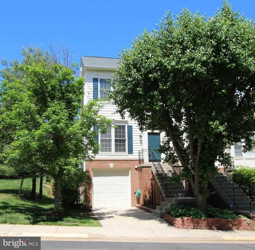Stunning and Spacious End Unit Townhome  with one car garage-  Backs to Trees and sides to open space. 3 bedroom and 2.5 bathrooms. Gourmet Kitchen with Granite counter tops, Stainless Appl. and Glass block  back splash. Walkout Lower level with Fireplace. Deck and fully fenced yard. Updated bathrooms w granite and tile flooring. Custom paint- you wont be disappointed. Minutes to One Loudoun!
