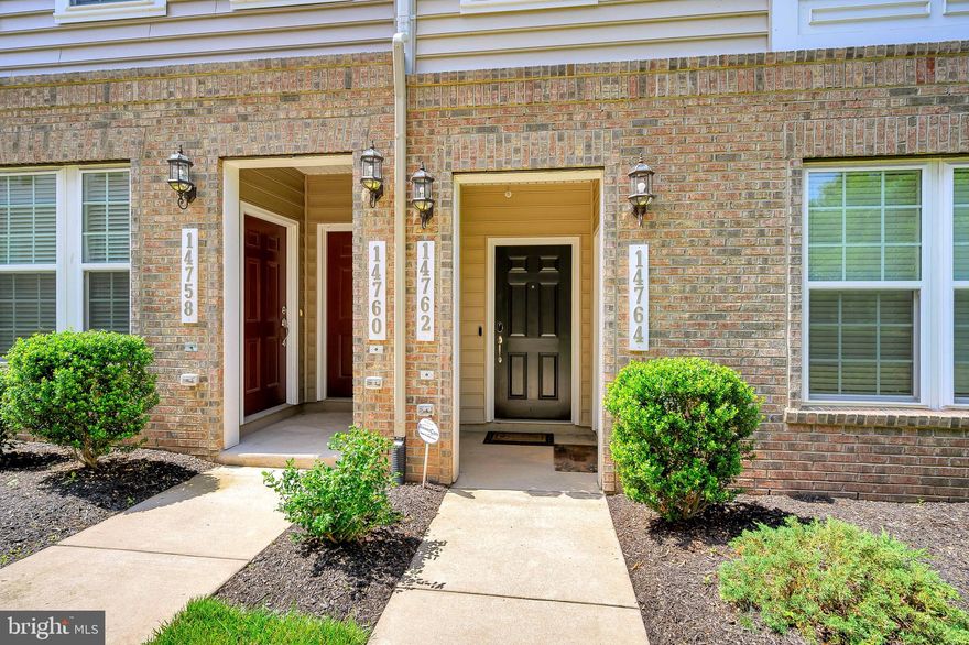 Welcome home to a magnificent end unit condo w/ spacious open floor plan, high ceilings and tons of natural light.  Situated in a perfect location for privacy and lush green views; we are located .9 miles from Stonebridge Potomac Town Center and 1.8 miles from Potomac Mills.  This well designed layout provides flexibility, affording you the opportunity to utilize the space as it best suits your style of living.  Do you often find yourself constantly looking for a place to store your kitchen items and groceries, well look no further, as this gourmet kitchen with enormous center island and pantry, will satisfy all your storage needs.  The chef of the house will enjoy the abundance of space, granite countertops and stainless steel appliances and can easily stay connected to family and guests while preparing meals.  Off the kitchen is the den which can easily function as the dinning area or office.  On those cold winter nights enjoy the additional warmth and ambiance of the stone encased fireplace strategically placed between the family and dinning rooms.  As you ascend the hardwood staircase into the warm and inviting master bedroom you will be immediately drawn to the incredibly modern wood accent wall.  Don't stop there as the master walk-in closet provides ample storage for your apparel and the ensuite includes a private water closet and large shower w/ a built-in bench.  Down the hall you will find two additional bedrooms, a hall bath w/ double sinks and the laundry room, where we left something for you - yep, front loading washer and dryer.  Don't miss out...this one won't last long!!  Make it your home today...