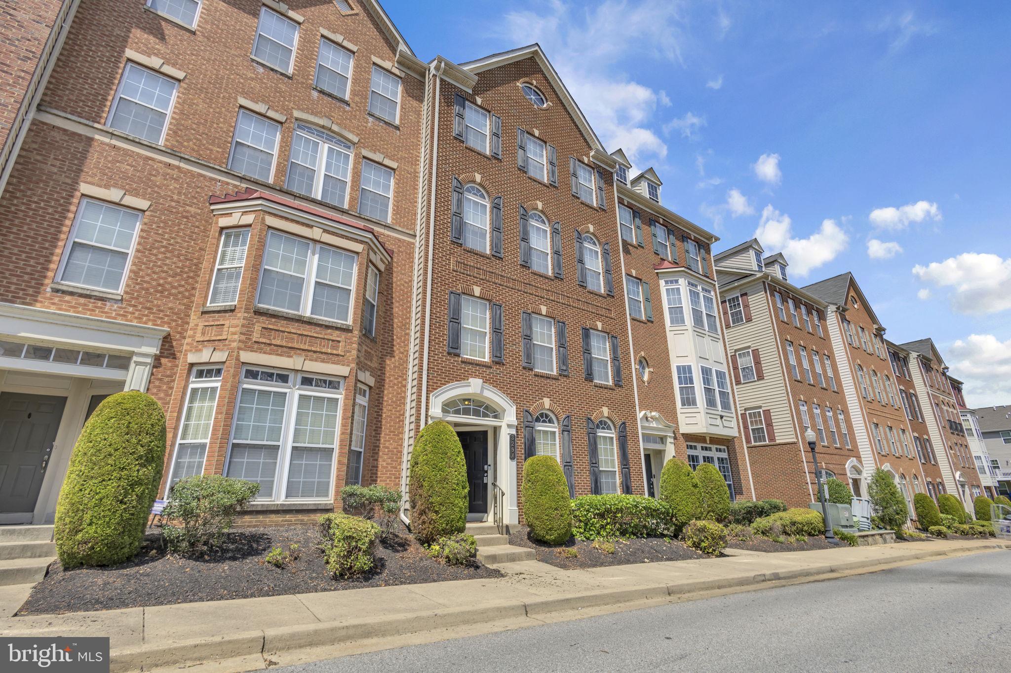 Welcome to this beautiful brick-front condo townhome offering comfort, space, and thoughtful upgrades—perfect for easy living. The main level features a bright, open layout with gleaming hardwood floors, 9-foot ceilings, built-in speakers, and large front windows with charming half-rounds—plus, curtains and blinds convey. The elegant island kitchen opens to the dining and living areas and includes granite countertops, stainless steel appliances (including a high-end Samsung smart fridge), 42” cabinets, pendant and recessed lighting, and a breakfast bar. Enjoy the convenience of a main-level powder room and an attached one-car garage with opener. Upstairs, you’ll find 3 spacious bedrooms, including a lovely owner’s suite with a tray ceiling, ceiling fan, new carpeting, two closets, and a private bath with dual vanities, tiled shower with multiple shower heads, and a separate commode area. The two guest rooms also feature high ceilings, and one has direct access to a maintenance-free deck with a transom window above the door for extra light. Recent updates include a new carpet, and newer HVAC system & water heater—making this home both beautiful and efficient.