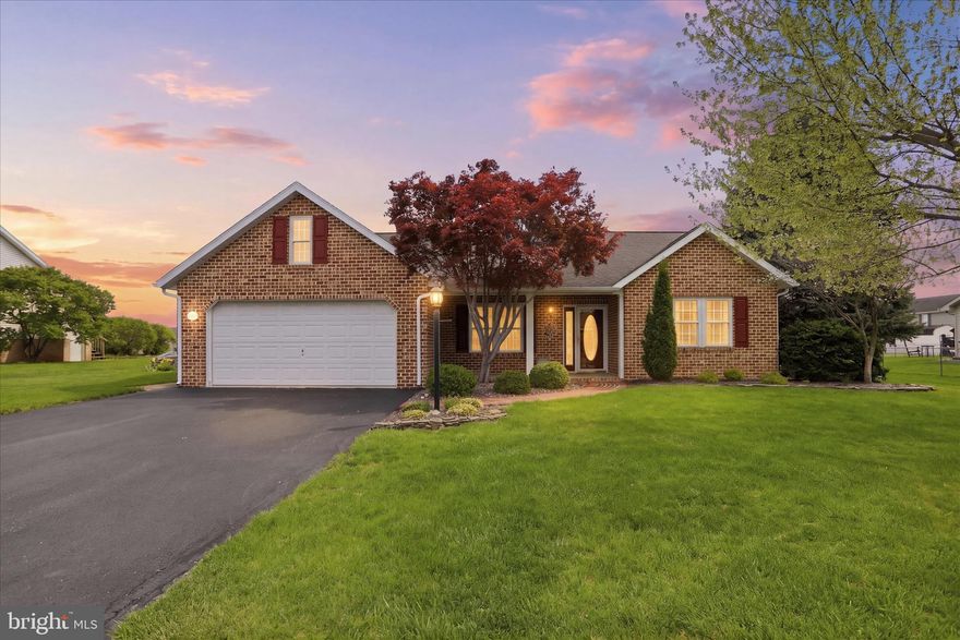 Welcome to this charming all brick rancher located in the Laurich Meadows neighborhood! A lovely brick sidewalk leads you to the inviting front entry, complemented by mature landscaping that enhances the home's curb appeal. Once inside you will notice the spacious living room that flows seamlessly into the dining area and kitchen, creating an ideal space for both everyday living and entertaining. The kitchen is well-appointed with stainless and black appliances, including a flat-top stove, built-in microwave, double sink and a convenient pantry for extra storage. The primary suite features a private full bath, a ceiling fan and a generous walk-in closet. The second bedroom, full bath and laundry closet are at the opposite side of the home, offering added privacy. Enjoy your morning coffee or unwind in the bright and airy sunroom, which opens to a rear patio finished with a stone epoxy coating-perfect for outdoor relaxation or gatherings.  Additional highlights include a two-car garage and a nicely sized shed in the backyard for extra storage. Located within the Borough, this home also offers borough utilities, making it as practical as it is appealing. Don't miss out on this opportunity!