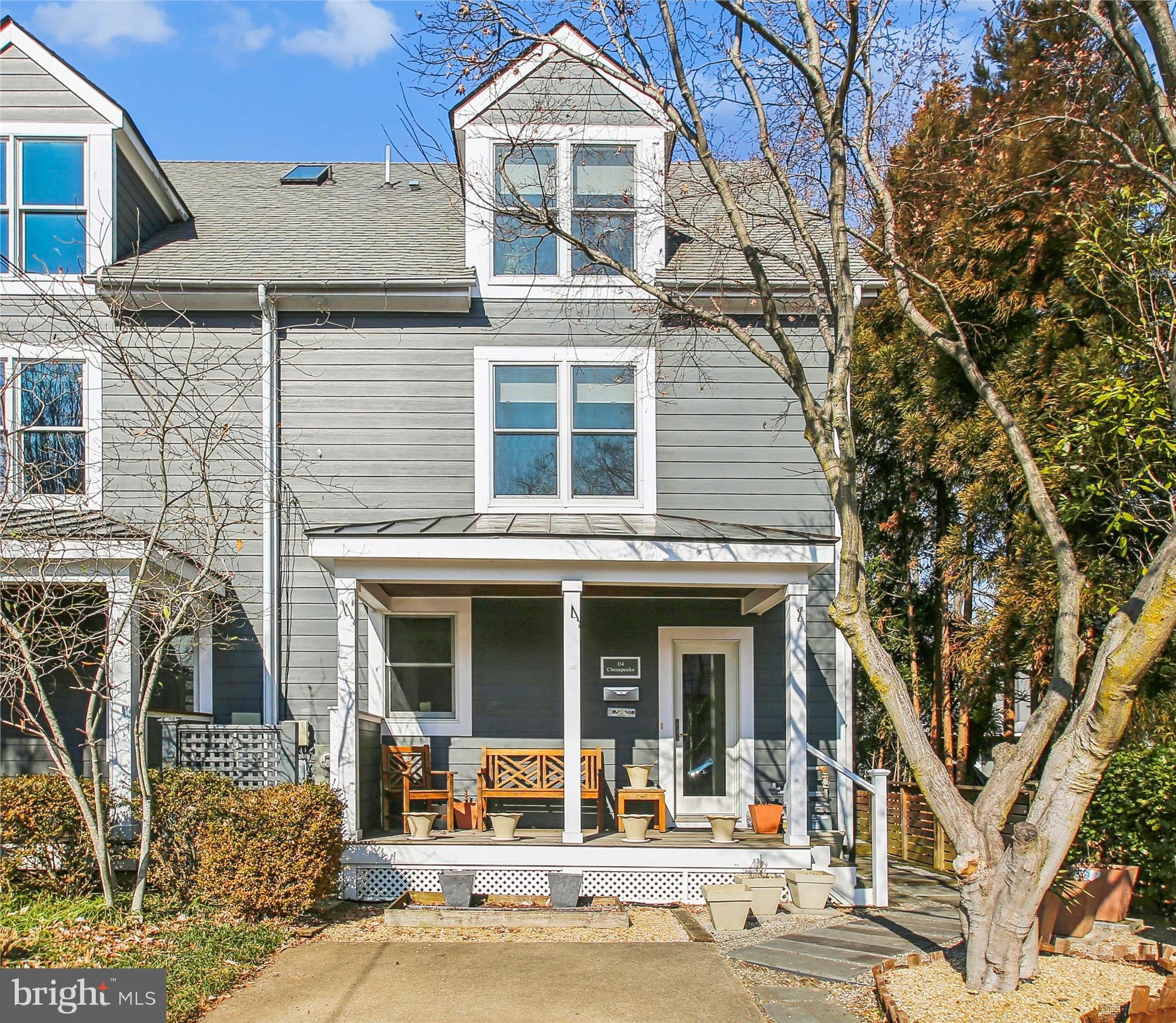 This finely appointed 3 bedroom, 3 ½ bath duplex in the heart of Eastport has an expansive, fully fenced back garden, a front porch and off-street parking for two cars. Strict attention to detail is evident in all aspects the 2014 complete structural, mechanical, electrical and aesthetic renovation.
The bright kitchen has custom solid hardwood cabinets, some with beautiful glass doors and shelves, granite countertops and stainless appliances. Gleaming acacia hardwood floors grace the kitchen, living room and side entry. The large living room leads to the dining room/sunroom that was added in 2022. This room has a heated ceramic tile floor and 2 skylights. Step through the double glass sliding doors and down just three steps onto the patio. There is a raised at deck at the rear of the garden.
There are two bedrooms on the second level, both with ensuite baths. The primary bedroom with ensuite bath and an alcove/office are located on the third level. There is ample storage throughout the house.