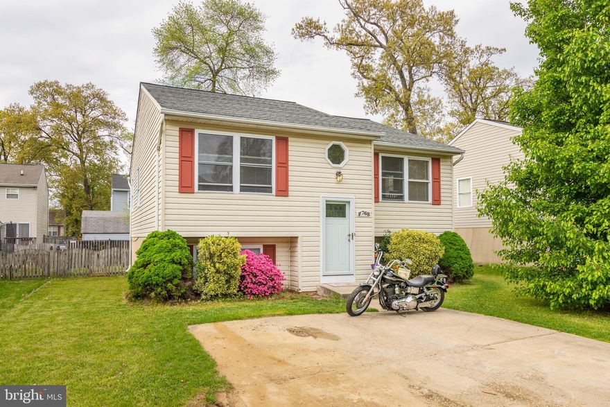 Adorable split foyer with hardwoods in living room and foyer.  3 bedrooms and 2 baths on main level. Lower level has family room and what could be 4th bedroom or office and 1/2 bath. New carpet in lower level. Back yard is fully fenced with a deck for entertaining.