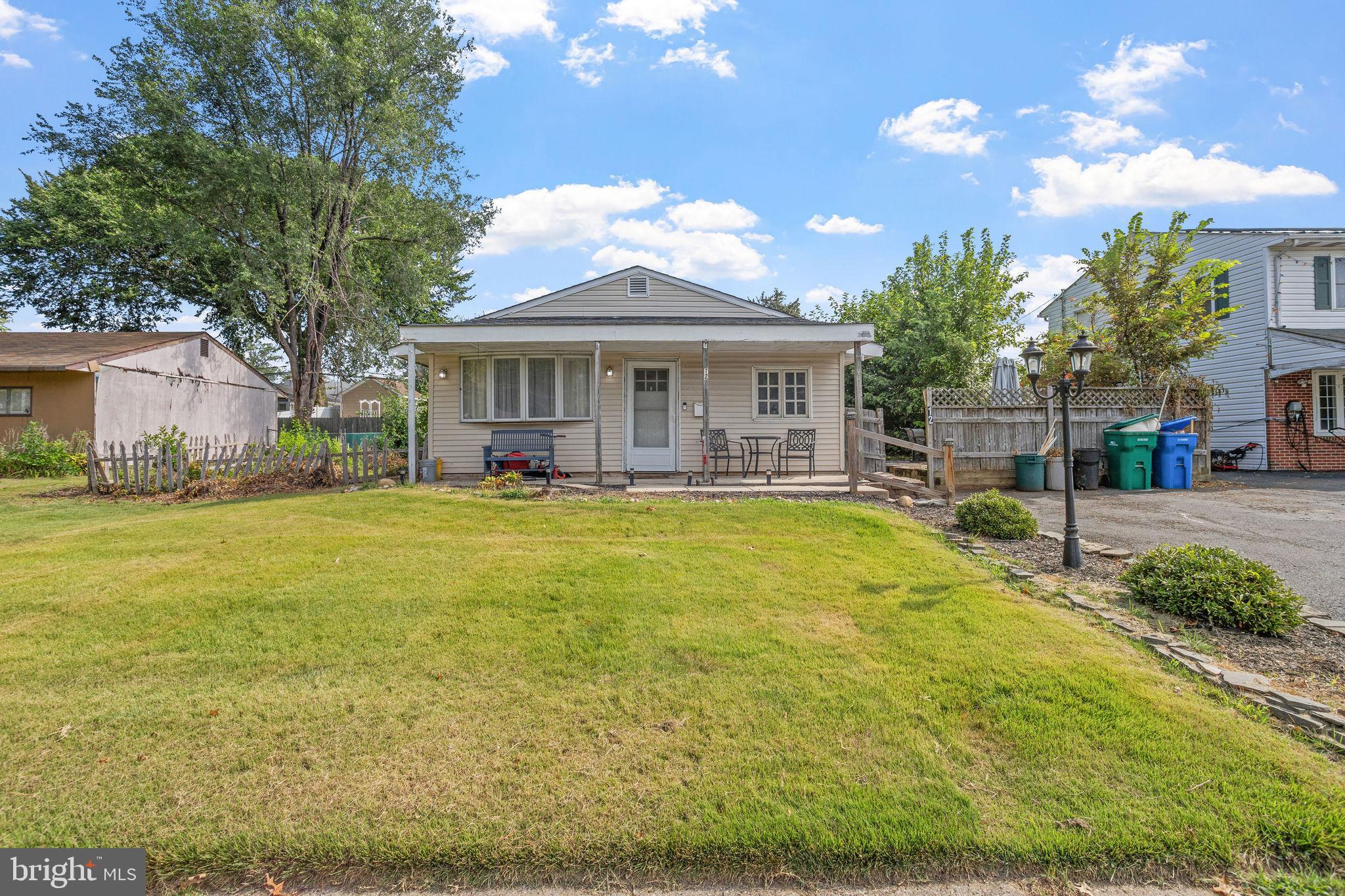 Don't miss this charming 3-bedroom, 1-bath ranch on a quiet, tree-lined street in desirable Magnolia Hill neighborhood. This home features a spacious eat-in kitchen, dining room, cozy fireplace, and durable vinyl plank flooring. Enjoy outdoor living on the deck and the convenience of a paved driveway. Recent updates include a new roof, adding peace of mind for years to come. Centrally located with easy access to commuter routes, local parks, shopping and schools. This home is truly cute as a button!