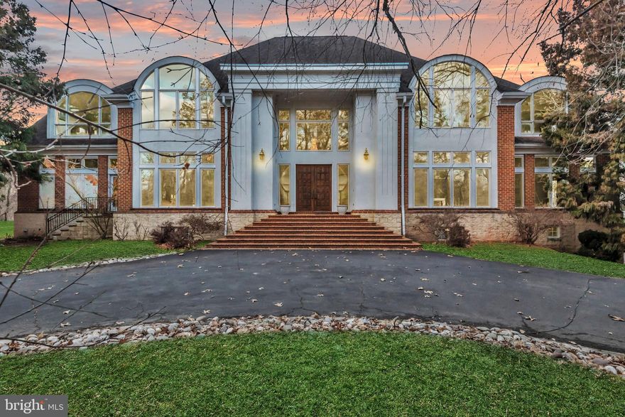 A Masterpiece on the Potomac
 The largest and most iconic sale in Prince George’s County—a breathtaking sanctuary of luxury and distinction. Nestled on 10.57 acres of pristine landscape, this palatial 16,000 plus -square-foot residence offers an unparalleled blend of grandeur and comfort, boasting 700 feet of Potomac River waterfront—the largest in the county. A gated entrance opens to a stately extended driveway, leading to a graceful roundabout and a grand, oversized entrance framed by majestic exterior steps. Inside, a two-story atrium foyer with marble floors and a sweeping double-curved staircase welcomes you to an environment of timeless elegance. The main level is designed for both lavish entertaining and relaxed living, featuring two formal dining rooms, a spacious living room, a game room, and a large open kitchen with an extended island eat-in area adjacent to the family room. Direct access to the rear balcony offers seamless indoor-outdoor flow and panoramic views. The indoor pool, visible from the main level, invites serenity, complemented by a pool deck with steps to the lower pool area. The estate’s expansive layout includes 9 total bedrooms, a bonus room, 7 total full bathrooms, and 1 half bathroom. The upper level showcases five bedrooms, a bonus/sitting room, and an opulent primary suite with a private terrace capturing sweeping views of the Potomac River, the Woodrow Wilson Bridge, and neighboring Alexandria, VA. A fully functional attic space provides versatility with a spacious bedroom, a multi-use flex room, and an upper loft. The meticulously designed basement offers a 2-bedroom apartment with a full bathroom and a large eat-in kitchen, a theater room, a lounge area, and direct access to the in-ground pool area and a side 5-car garage. Embrace the ultimate in luxury living  where architectural beauty, sophisticated interiors, and unrivaled waterfront vistas create an extraordinary residence without peer.