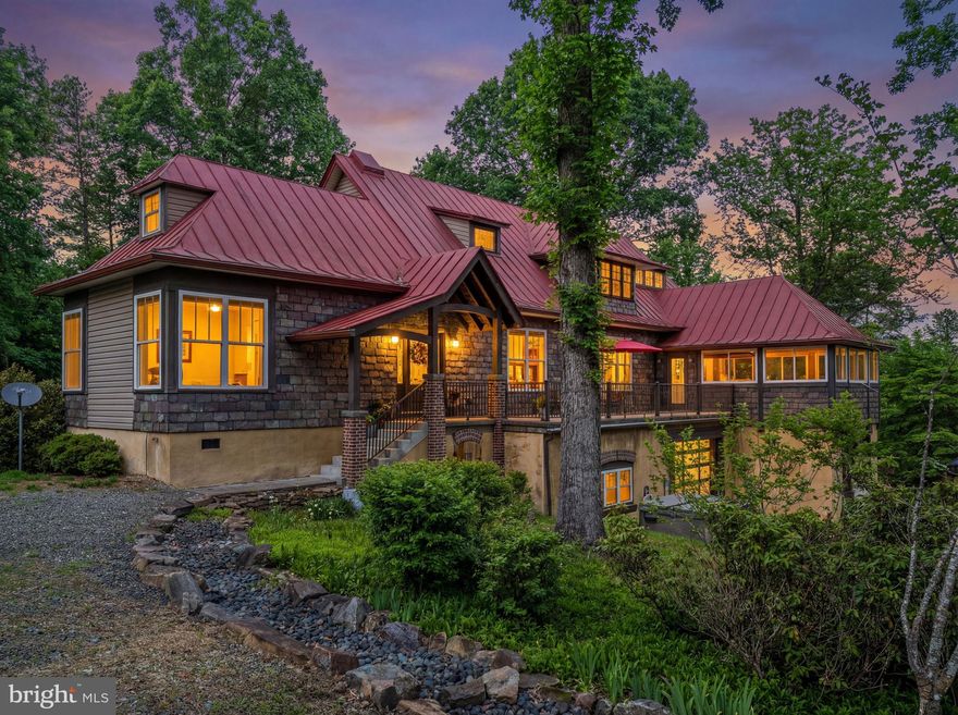 2 BR Main House & 1 BR plus flex den in the Guest Cottage!! However you describe perfection in a home, this is it! Exquisite space, light, detailing, and a quietness in its setting, puts this uncommon residence on 26 private acres above all others.  The discerning buyer will luxuriate in the 27' X 48' primary suite occupying the whole upper level in the main house. For those who like to entertain, the main level is open and features an exceptional great room with high ceilings and a mosaic marble foyer, a dining area overlooking an interior garden, a spacious kitchen with granite counters and a stylish four-stool bar, a  delightful sun room, a second bedroom with ensuite bathroom, and more. The full-sized walk-out lower level has a workout room, office space, workshop, and dual entry 4-car garage with 10" doors.  The 26-acres offers a private setting, yet easy access to the trendy towns of Sperryville and Washington, Virginia. Just a short distance to prime hiking at Old Rag Mountain, White Oak Canyon, and the Shenandoah National Park, or you may delight in the numerous art galleries, award-winning restaurants, live theatre, music scene, and wineries that make Rappahannock County your special country place!