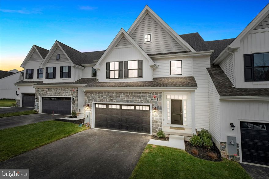 Welcome to 405 Leahy Dr., available for immediate delivery.  Fabulous new pricewith numerous updates!  This new construction Murray floor plan on homesite #24 in Briar Creek, an active adult 55+ community, located just minutes from downtown Newark, the University of Delaware, White Clay Preserve, Fair Hill Nature Area, Christiana Hospital, Shopping, and I-95.  The Murray floor plan is an interior unit townhome offering approximately 2,900 sq ft, featuring three bedrooms, two complete and one half bathroom, and the primary suite on the main level!   Entering the home, you will be delighted by the open floor plan, perfect for entertaining.   The owner's suite features two large walk-in closets and a luxurious owner's bathroom with a tiled shower, bench seating, dual shower heads, and a comfort-height dual vanity with a granite countertop. The gourmet kitchen showcases a large center Island with a quartz countertop, gas cooktop, double ovens, and drawer microwave.  42 " cabinets, stainless steel appliances,  oven hood, and luxury vinyl plank flooring throughout the main level.  The gathering room overlooks the community pond and open space, features a linear gas fireplace, and opens to the Trex deck. The remaining main-level space includes the laundry room and powder room.  Upstairs, you will find a loft that can be used as a home office, workout area, or additional den, two nicely sized bedrooms,  LVP flooring throughout, and a complete bathroom with tile flooring.  The lower level features a full basement with a walkout to the rear yard and open space.