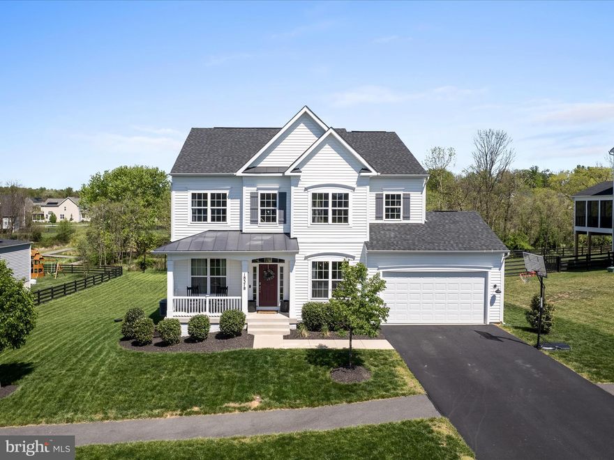 SELLERS OFFERING A $10,000 CLOSING COST CREDIT AS WELL AS RECENTLY  LOWERING THE PRICE $50,000. AMAZING FOR THIS EXCEPTIONAL HOME?   SELLER READY TO FIND THE BUYERS THAT WILL  ENJOY THIS BEAUTIFUL HOME IN THE GREAT LOCATION AS MUCH AS THEY HAVE.  Welcome to your dream home in a sought-after neighborhood! This stunning 6-year-old residence boasts numerous upgrades and a perfect blend of comfort and modern living. This SMART HOME makes daily living enjoyable. For example, you can create personalized settings for movie nights, parties, or family gatherings by adjusting lighting, and entertainment systems with ease. With 5 spacious bedrooms and 3.5 luxurious baths, this home is designed to accommodate families of all sizes.
Step inside to discover an inviting open floor plan enhanced by an extended bump-out on all levels, creating generous living spaces filled with natural light.   Gourmet kitchen has quartz counters, farmhouse sink and upgraded cabinets.  The expansive primary suite has extended space for a home office or exercise area.   The primary suite has 2 walk-in closets.  The finished lower level offers additional versatility, perfect for a recreational room, home office, or guest suite. It is also great for entertaining, with a built-in beverage area that will impress your guests. Enjoy your expansive front porch with views of Sleeters Lake. Situated in a walkable community, you'll enjoy a beautiful lake and well-maintained playgrounds, making outdoor activities a breeze. This home combines lifestyle and luxury while being in a vibrant neighborhood that you will love to call home!