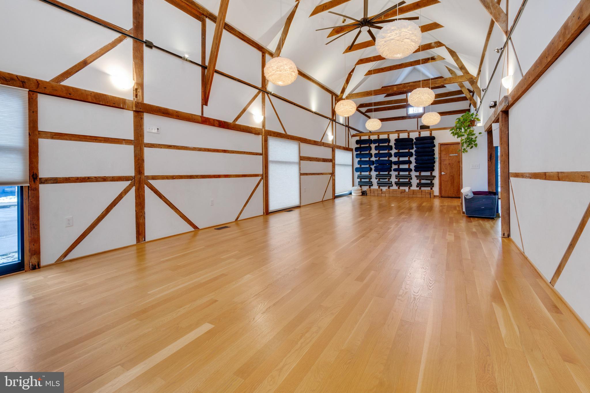 The Annex/Seed House at Radcliffe Mill is a stunning, one of a kind space. Fully restored in 2007, with additional work done in 2017 to add a built out cafe space, The Annex/Seed House now houses a wellness center, complete with a café, wellness-related offices, and a spectacular studio. The property's zoning allows for a wide array of uses. Keep the space in its current configuration or build out into a full scale restaurant or transform it into office space or apartments.
The Annex dates back to the early 1900s and The Seed House to the 1970s. Today, the blended building features soaring ceilings, exposed woodwork, and meticulously restored standing end 2x4 flooring. Presently, the building accommodates a diverse range of wellness practitioners, with the studio space and café awaiting the creative touch of a new occupant. The sale includes all café equipment, including refrigerators, freezer, ice maker, keg tap, a warming oven and more. Five of The Seed House offices are on the ground floor, with a sixth office on the second floor, along with additional storage and laundry facilities.
Radcliffe Mill is on the National Register of Historic Places (see documents), and having previously received historic preservation tax credits a new owner could benefit from a shorter process for further property development and improvement tax credits. The property is also in a Maryland Enterprise Zone, and an Opportunity Zone and eligible for energy improvement incentive programs. Radcliffe Mill is strategically located one-mile from downtown Chestertown, a short walk along the rail trail, which used to run directly to the grain elevator. Founded in 1706 on the banks of the Chester River, Chestertown is home to Washington College. Located approximately 80 miles from Washington, DC and Philadelphia, PA and an hour from Wilmington, DE, Chestertown hosts a number of vibrant festivals throughout the year and an active arts and entertainment district.
The property consists of two different parcels, and each parcel is also being offered for sale separately as well as together. The sale of 860 High Street alone is contingent on a lot line adjustment. Tax amounts will be adjusted upon completion of the lot line adjustment.
Buyers requesting additional information must sign a Non-Disclosure Agreement.