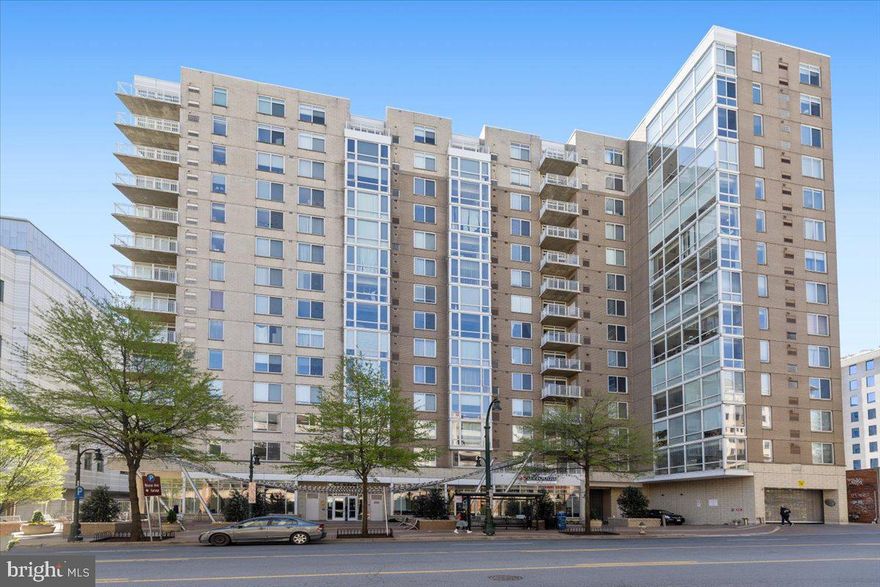 Set in a vibrant and well-connected corner of Downtown Silver Spring, this corner residence at the Crescent offers a lifestyle that feels both effortless and invigorating. Floor-to-ceiling windows fill the home with natural light throughout the day, creating a bright and airy atmosphere whether you're easing into the morning or relaxing at the end of the day.

The layout flows seamlessly from the sunlit living area, highlighted by newly installed hardwood floors, into a well-appointed kitchen with granite countertops and stainless steel appliances. The primary suite serves as a peaceful retreat with a spacious walk-in closet, an additional closet, and a private bath, while the second bedroom and full bath provide versatility for guests, a home office, or both.

Life here extends far beyond your front door. Step outside and enjoy one of the most vibrant and convenient neighborhoods in the DC area, with restaurants, grocery stores, coffee shops, and entertainment just moments away. Whether you're heading out for dinner, catching a film at the AFI, or taking the Metro into DC from a few blocks away, everything is within easy reach. The soon-completion of the Purple Line, with a station located at the library next door, will make commuting by rail even easier. For days you prefer to drive, the covered garage parking space is ideally located near the elevator for added convenience.

The Crescent adds to the experience with a pet-friendly atmosphere and amenities that make everyday living easy, including an on-site manager, fitness center, billiard room, and resident lounge. Regular community events foster a welcoming sense of connection and bring neighbors together in a way that makes city living feel surprisingly personal.

This is a home where comfort, convenience, and community come together in the heart of Downtown Silver Spring.