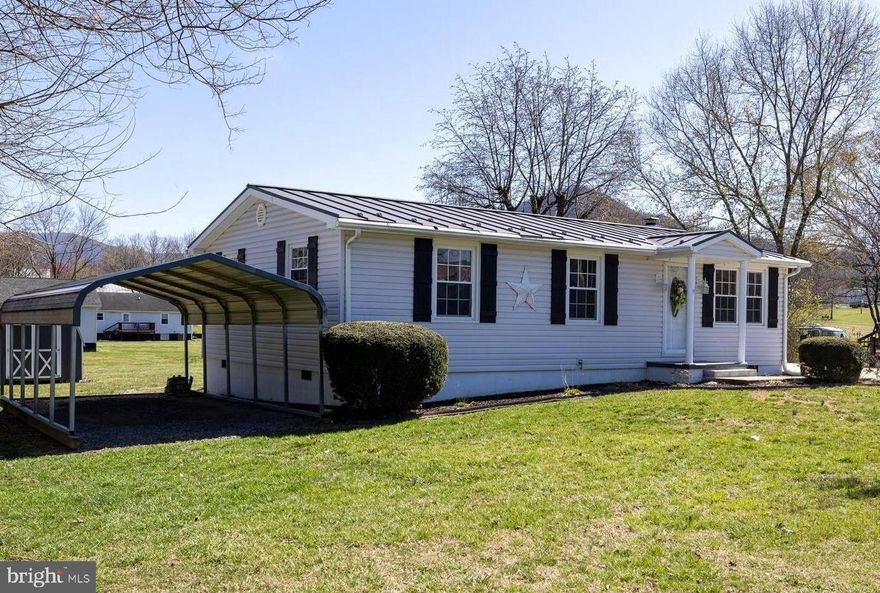 Charming, move-in ready home, with mountain views, in the town of Stanley.  Discover the perfect blend of comfort and convenience in this well-maintained home! The home features a remodeled kitchen with a pantry and eat-in dining, a main-floor designated laundry room/mudroom with outside entry off the deck, and a heat pump with A/C.  The spacious back deck is perfect for relaxing or entertaining and offers access to the large flat backyard.  A concrete driveway, vinyl siding, new vinyl railing, and metal roof all contribute to the home’s low maintenance exterior. Storage shed and metal carport included.  In-town utilities and no HOA.