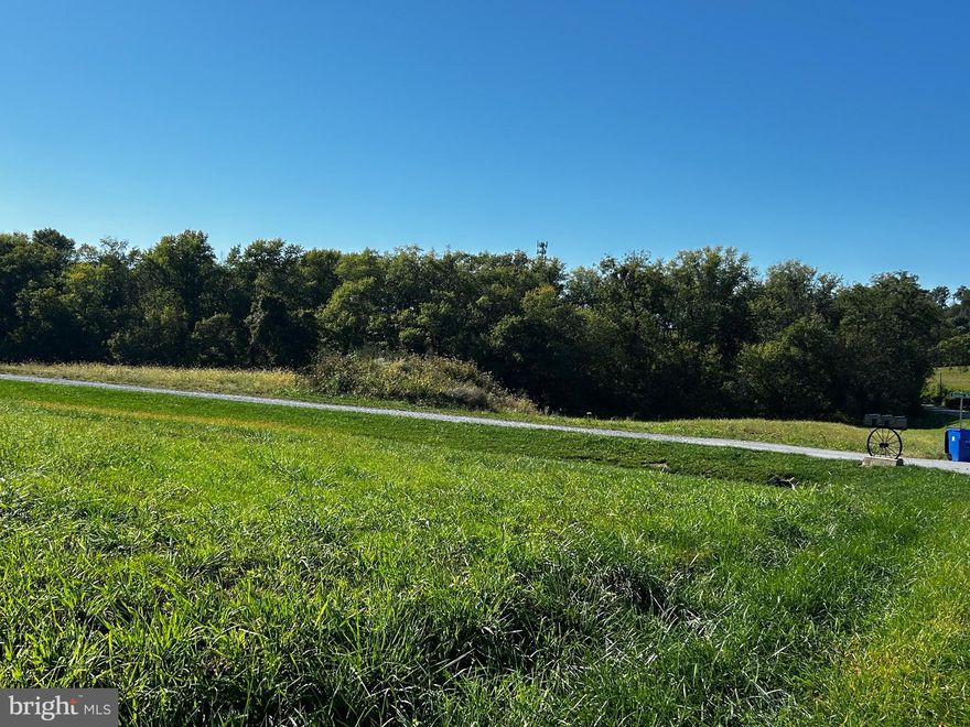 Build Your Dream Home in Scenic Glisan Farms – 7192 Rosalees Way, Frederick, MD 21701 Nestled in the rolling hills of the picturesque Linganore wine region, this stunning cleared lot offers the perfect blend of rural charm and modern convenience. Located just off Old Annapolis Road and minutes from vibrant downtown Frederick, this homesite offers easy access to commuter routes including I-270, while still providing the serenity of country living. Offered by Maryland Heritage Custom Builders, Inc. in partnership with Glisan Farms, Inc., this property is part of a boutique community featuring expansive views, open green space, and thoughtfully placed homes. Property Highlights: Approved for a 4-Bedroom Home; Perc-approved at-grade mound septic system (gravel-based for reduced cost); 600-foot deep private well producing 1.5 GPM; Electric service nearby, with transformer adjacent to the lot; Gently sloping lot, ideal for a walkout basement; Front of house must face shared driveway for uniform aesthetics; Shared driveway maintenance agreement with two neighboring properties; Asphalt apron already in place at the entrance from Old Annapolis Rd; final driveway paving to be completed after the third home is built; No cable access; Starlink internet has worked successfully for neighboring homes; Previously part of a working farm, this lot retains its pastoral charm while offering the infrastructure needed to build a beautiful custom home. Whether you're seeking tranquility, views, or proximity to the region’s best amenities and wineries, 7192 Rosalees Way delivers.