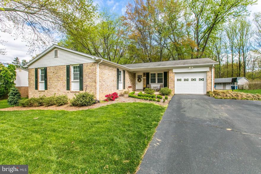 Updates from top to bottom in this polished Rambler with garage in sought after Orange Hunt Estates! More than 1/3 acre lot with flat fenced rear yard! Main level living at it s finest! Short walk to Sangster Elementary, multiple creeks, playgrounds, and parks. Updates include eat-in Kitchen with stunning white custom cabinets, quartz countertops, stainless steel appliances, and a perfect view of the back yard. Windows and HVAC 2014. ALL 3  FULL bathrooms elegantly remodeled. Spacious master suite w/full bath, dining room and sun-filled living room. Walk out basement includes large recreation room with fireplace, legal 4th bedroom, full bath, ample storage. West Springfield HS pyramid. South Run Rec Center. Starbucks and grocery - all just a 1 mile walk. A short walk to Cottontail pool (membership available), perfect for gathering with family and friends for the Summer months!