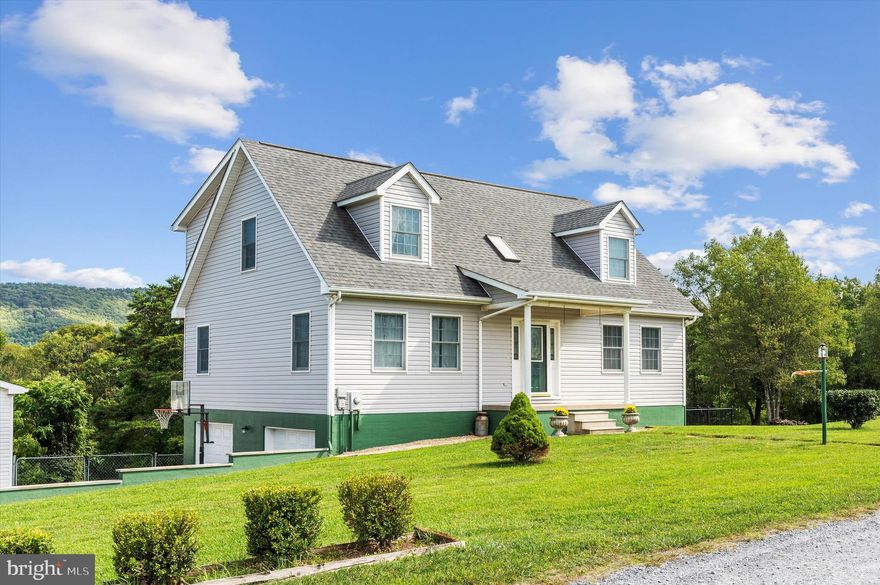 Don’t miss out on a Fantastic opportunity on this large, well maintained Cape Cod Home!  Boasting over 2100 finished square feet of living space and an unfinished walk out basement with unlimited possibilities.  From the covered front porch, you are greeted with an expansive entry foyer and beautiful hardwood flooring.  Also on this level are the Formal Dining with bay window and Living Rooms, Primary Bedroom with Private Bath and a enormous Country Kitchen with eat in area, oak and glass front cabinetry, luxury vinyl plank flooring, deck access to mountain views and even a pellet stove for ambiance. Ascend the hardwood staircase to the spacious upstairs and find two additional large bedrooms and a third bedroom which would make a great in-home office.  The unfinished basement has a two-car garage and plenty of room or storage, work areas or additional future finished space.  Outside you will find a two-car detached garage, paved driveway, partially fenced back yard and an inviting above ground pool with deck area.  This is a truly unique home and is waiting for you!