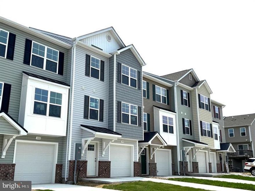 The next phase is now available for Summer delivery, and there's still time to select interior color schemes!  Brand New Townhomes in The Communities of Burwell! The difference is in the details — and they’re all included!  Discover the perfect blend of comfort, style, and convenience in these beautiful new townhomes offering 1,915 sq. ft. of thoughtfully designed living space. The open main level welcomes you with luxury vinyl plank flooring, a spacious family room extension, and a stunning kitchen featuring granite countertops, stainless steel appliances, and a large island with bar seating—ideal for entertaining or everyday living. Upstairs, the impressive primary suite showcases vaulted ceilings, a generous walk-in closet, and a spa-inspired bath with a tile shower and glass door. Two additional upstairs bedrooms provide plenty of space for family, guests, or a home office. The finished lower level includes a fourth bedroom and full bath, offering flexible options for your lifestyle. A brick-accented exterior,  10x12 rear deck, 1-car garage with opener, and concrete driveway complete the package—enhanced by ample overflow parking just steps away for added convenience. Ideally situated just minutes from I-81, shopping, grocery stores, and popular restaurants, The Communities of Burwell offers both modern living and everyday ease.  Stop by our Model located at 84 Barrier Reef to take a tour!  Similar construction available to view.  Photos are of similar construction.