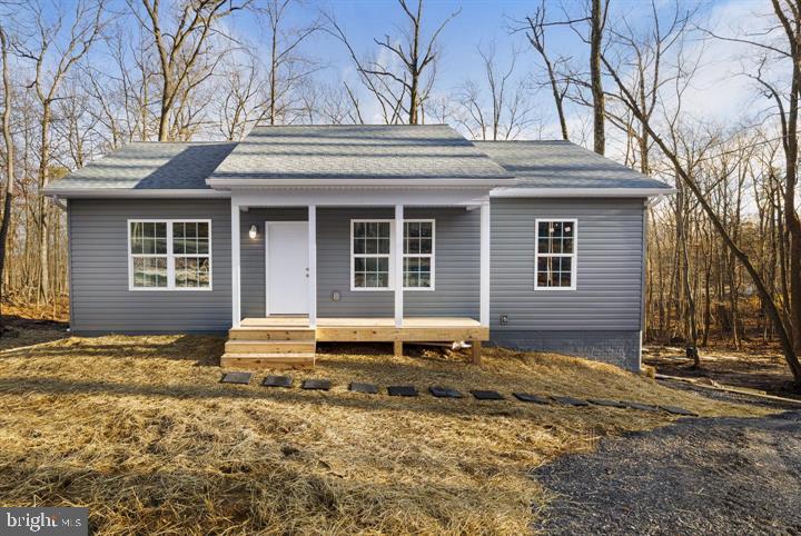 ** Seller is offering $5,000 in closing assistance** This is a fantastic opportunity to purchase a new construction home and have the ability to select the colors and finishes desired. Construction will begin when a contract is in place, giving the purchaser the ability to be involved in the process from day one while also being able to customize the home by way of numerous optional upgrades. Estimated completion will be within six months of the contract date. The purchaser can choose between two different lots. The home pictured is a similar build on a different lot. This home will be a larger square footage than the one pictured but will have the same design and elevations. The home can be built on either a slab or a crawlspace. Some standard features included are vaulted ceilings, granite kitchen countertops, shaker-style cabinets with brushed nickel hardware, recessed lighting, ceiling fans with LED light fixtures, luxury vinyl plank flooring, and a washer and dryer will be included. Wilde Acres community is located in western Frederick County, VA. The location offers outdoor enthusiasts numerous activities to pursue, including hiking, fishing, hunting, etc. The community features a common area with a stocked fishing pond, pavilion, and playground. (Photos are of a similar build).