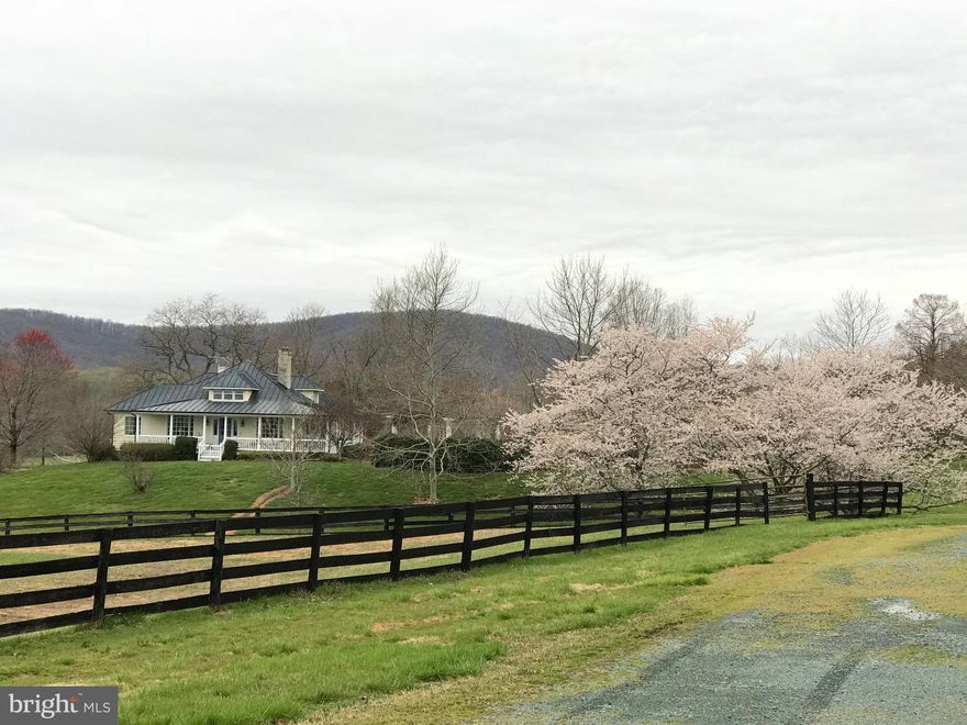 A private 70 ac estate located among other estates in the Keswick Hunt area of Albemarle Cty. The 1920 s home is situated on a knoll in the center of the manicured acreage, with dramatic views of the SW Mtns. Though very convenient to C'ville, this 4 BR home is insulated from road noise, and extremely private.