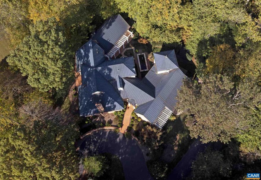 WINDTRYST is a substantial, custom built and architect designed home by the current,original owners.The features and attention to detail that mark a well thought out design layout are immediately apparent when one enters the foyer highlighted by custom wood inlay design matching the leaded glass transom over the mahogany entrance door.Venturing right from the foyer will lead you past a gallery to the private office with artist loft above and a view of the goldfish pond.Left will lead you past separate dining and living rooms into the recently upgraded kitchen and breakfast area. Access from the kitchen is an enclosed porch with convertible storm window and screen openings.Adjacent to the spacious Kitchen is a Family Room with corner fireplace. Both rooms feature full length windows providing gorgeous pond and mountain views.The first floor, large master suite is conveniently located adjacent to these most-used rooms of the home. An additional private guest room wit h full bath is also on the first floor. Two bedrooms with full bath and walk-in attic storage all on the second level. An oversized two car attached garage is accessible from the laundry hallway. Also a detached 3 car garage w/ workshop.,Painted Cabinets,Fireplace in Family Room,Fireplace in Living Room