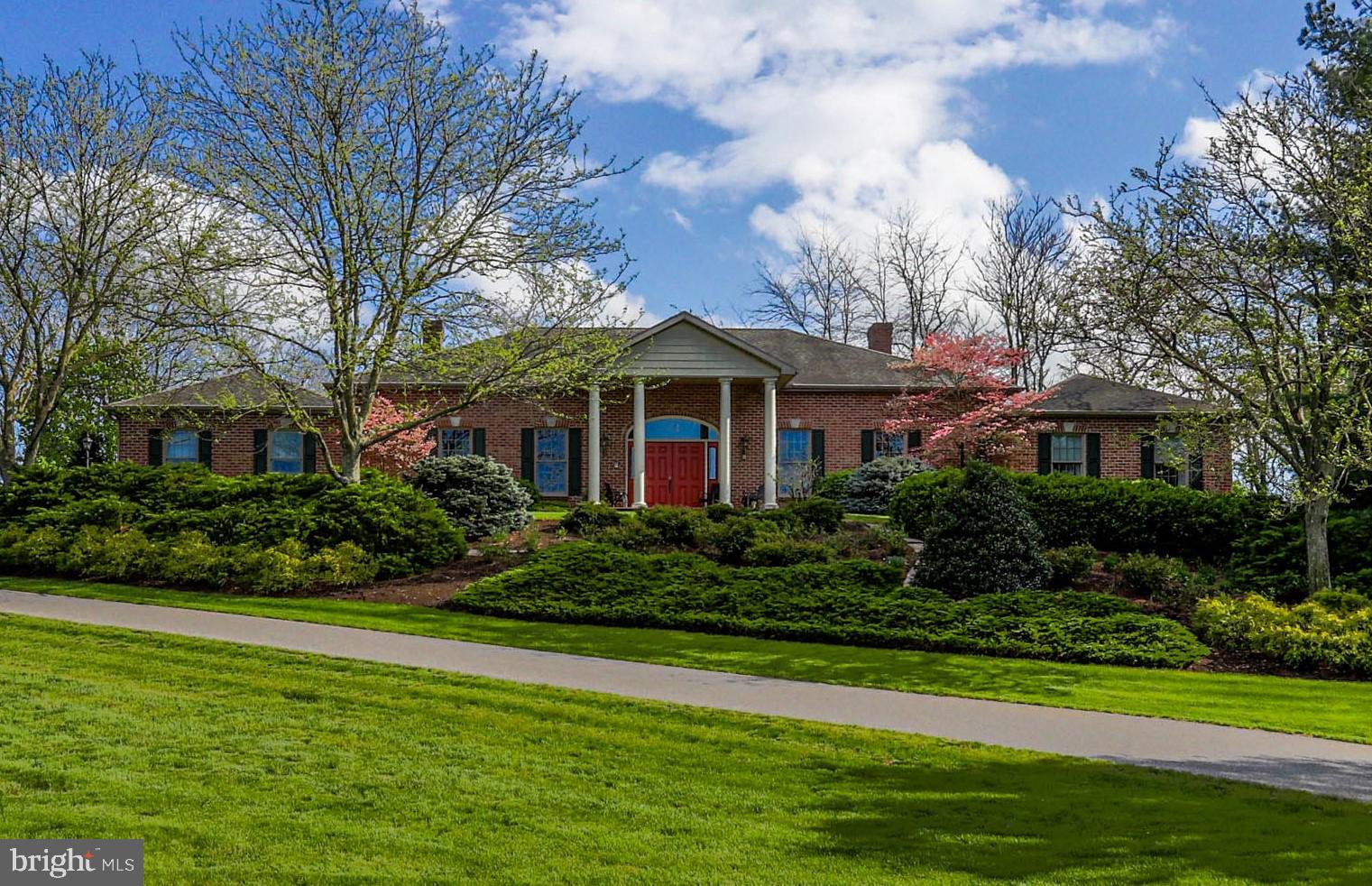 Lovely custom brick rancher with 4400 sq. ft. of first-floor living area situated on over an acre of ground with a large flagstone patio and privacy to farm land at the rear. If you enjoy cooking, this oversized kitchen with all appliances, two ovens, and walk-in pantry is your dream. There are four large bedrooms and 3 full baths. Bedrooms boast large closets with an additional walk-in linen closet off the hall. There is a living room, dining room, oversized family room with fireplace and walk-in room with wet bar to support entertainment. A large den /office is attractive with built-in desks and book storage. You will enjoy the hardwood floors, beautiful, 12-foot ceilings, and spacious foyer as you enter the house. There is an oversized three-car garage, central vac, and patio with built-in BBQ grill and water fountain. There is an underground dog fence, and all window treatments and fans will pass with sale. There are two heat pumps and two water heaters. Don't miss this; there are few custom ranch houses built with this quality. Can be shown same day. sentri box on front porch