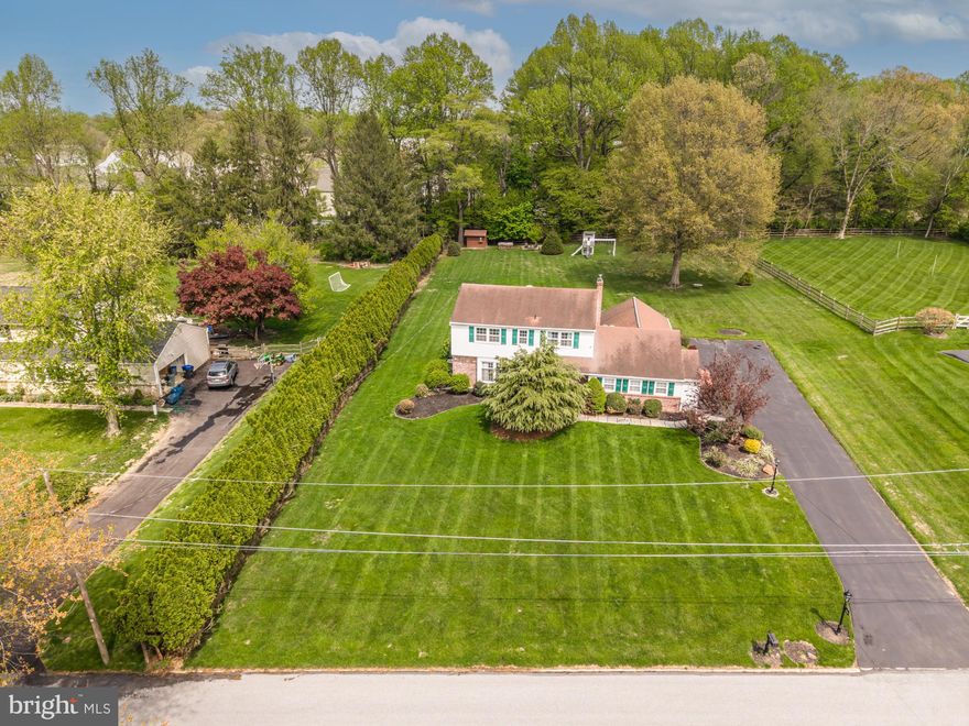 Beautiful 4-Bedroom Colonial on 1 Acre in Desirable Pasture View Farm | West Chester
Welcome to this well-maintained 4-bedroom, 2.5-bath Colonial set on a private, picturesque 1-acre lot in the sought-after Pasture View Farm neighborhood of West Chester.  Located in the award-winning West Chester Area School District, this home offers a great balance of peaceful suburban living and easy access to shopping, dining, and major highways.  Situated on a quiet dead-end street, the property provides privacy, tranquility, and scenic surroundings—perfect for everyday living.  Inside, you’ll find a sun-filled living room that flows into the formal dining room, highlighted by a bay window overlooking the backyard. The updated kitchen offers both style and function, while the main level also features a convenient laundry room and powder room. A cozy family room with a wood-burning fireplace creates the perfect space to relax, and the bright sunroom with cathedral ceilings, recessed lighting, and walls of windows adds even more living space.  Outdoor living is a standout feature, with an oversized deck and patio ideal for entertaining or unwinding. The expansive 1-acre backyard provides ample room for recreation and gatherings, surrounded by mature landscaping and peaceful views.  Upstairs, enjoy four generously sized bedrooms, including a primary suite with a walk-in closet and private ensuite bath. A full hall bathroom serves the additional bedrooms.  The finished basement offers flexible space for a home office, gym, media room, or play area.  This property offers space, comfort, and a prime location—a great opportunity to own in one of West Chester’s most desirable communities.