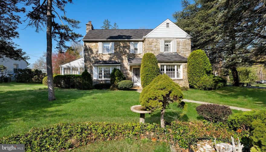 Charming, stately, stone colonial with an abundance of natural light and is located in the much sought after Meadowbrook community This lovely home features a cozy living room with a stone front fireplace, spacious dining room perfect for entertaining and an eat-in kitchen with a pantry.  Enjoy the inviting sunroom which has wall to wall windows allowing so much natural light. The  Primary Suite is really huge and includes two closets and a private bathroom. There are 3 other spacious bedrooms with lots of closet space and the back bedroom has a door that opens to a deck overlooking the inground pool and picturesque neighborhood.  This home also includes a convenient Powder room, hardwood floors under most carpet, 2 car garage and a  finished basement with a bar.  You'll love your outside private oasis and relaxing by the pool  or entertaining  in the fenced in backyard.    This beautiful home is a must see and has maintained its classic colonial charm throughout.  This home is truly a gem and is located near Lorimer Park, Alverthorpe Park, Pennypack trails, Holy Redeemer Hospital, public transportation, multiple train stations, restaurants, Whole Foods, Trader Joes and tons of shopping.