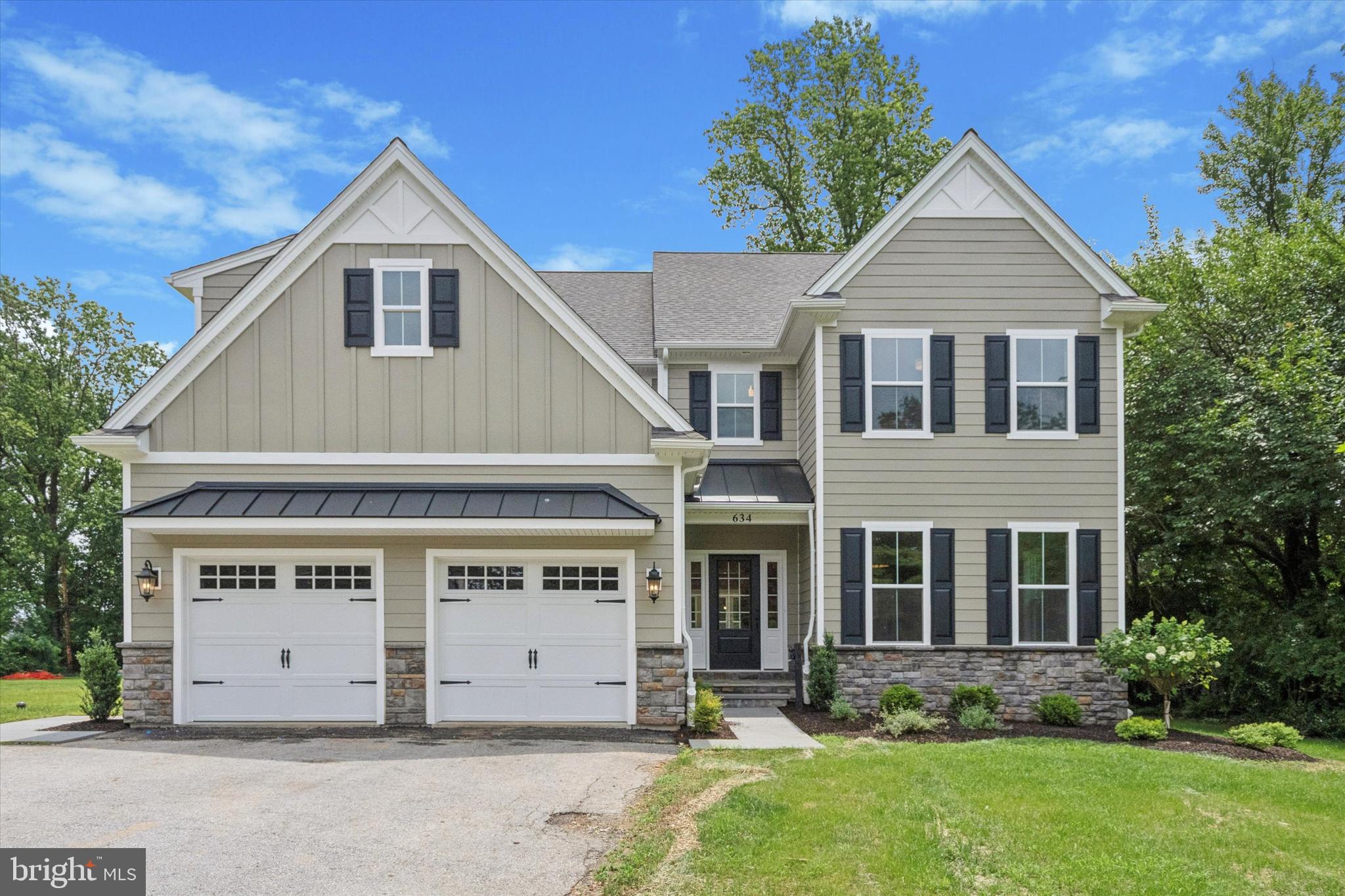 Rare opportunity for New Construction in a walk to Malvern location! Enjoy brand new living in this thoughtfully constructed home with a large, flat backyard located on a quiet street in Malvern Borough. Curb appeal from the street starts with cement board siding flanked by handsome metal roofs and beautiful field stone. The covered entry with gorgeous flagstone welcomes you into the large and bright entry foyer. Gleaming hardwood floors throughout this floor are accented by crown moulding and custom millwork and wainscotting throughout. Glass French doors welcome you off the foyer to a spacious home office with a 2nd set of glass doors to the Formal Dining Room. This wonderful gathering space offers beautiful wainscoting, chandelier and a place for many large gatherings, holidays and parties to come. The Dining area leads directly into the stunning open and bright Kitchen/Family Room area, the heart of the home. This amazing space features a 4x8 Island with built in cabinets and microwave, solid wood white cabinetry, quartz countertops, 6 burner GE Monogram cooktop, Double Oven and Bar area with glass cabinets and a built in drink refrigerator. This open and bright space opens to a wonderful family room with a direct vent gas fireplace flanked by custom shiplap. The sunny and bright Breakfast Room opens with sliding doors to a paver patio perfect for outdoor dining and overlooking your beautiful flat and wide backyard. Completing the first floor is a Mudroom off the 2-Car Garage with custom shelving, cubbies and built-ins along with 2 additional closets for all your storage needs. Heading up to the second floor is the large Primary Suite soaked in natural light with a large walk-in closet and gorgeous Primary Bathroom. This spa like bathroom offers gorgeous tile, a relaxing soaking tub and a breathtaking walk-in shower with glass doors and shower bench. Two sinks and a water closet complete this well appointed bathroom. Second floor continues with a large 2nd Bedroom with attached bathroom with a walk-in shower and tiled throughout. The 3rd and 4th Bedrooms are also of good size with plenty of closet space and share a Jack and Jill Bathroom with an extra large vanity, 2 sinks and bathtub. A convenient 2nd floor laundry area finishes this level with tile flooring, stainless steel laundry sink and attached cabinetry. The full size basement offers excellent storage opportunities and potential for extra finished space with tall ceilings, egress window and a poured cement foundation. A tremendous value located on beautiful and quiet Highland Avenue just a short walk to all the shoppes and eateries in downtown Malvern and Malvern Memorial Park.