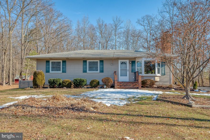 Welcome home! You will love everything this adorable home has to offer. Including a 32x24 detached garage, private 1 acre lot surrounded by trees, on a no thru street, driveway large enough to park an RV, work trucks or even a boat. Inside you will find a lovingly cared for 3 bedroom home with main floor laundry and hardwood throughout. The front door opens into a bright and sunny living room with a brick fireplace. The eat in kitchen features plenty of cabinet space, granite counters, an island and a beautiful bay window, from the kitchen walk into the large family room addition with vaulted ceilings, pellet stove, and even more windows to enjoy the views from the fenced in patio space. The finished basement is a perfect rec room with an additional room that could be used as an office or just for extra storage. This home also includes 2 sheds, surround sound, central vac, newer water treatment system, and HWH replaced in 2022. NO HOA