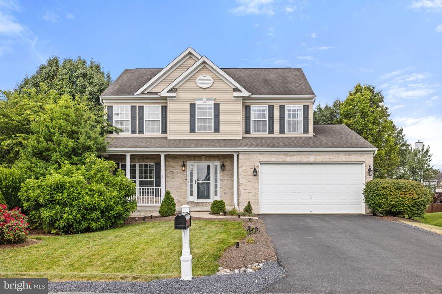 Welcome to this stunning brick-front colonial with a charming covered porch entry that invites you into your new home! Step inside to find beautiful new luxury vinyl plank (LVP) flooring throughout most of the home and soaring ceilings that create a grand first impression in the foyer.

As you enter, you're greeted by a spacious living room that flows seamlessly into the formal dining room, complete with elegant chair rail and crown molding—perfect for gatherings and entertaining. The stylish kitchen features granite countertops, stainless steel appliances, a generous pantry, and plenty of space for a table. It overlooks the bright and airy family room, which is anchored by a stunning stone gas fireplace, creating a warm and inviting atmosphere.

Sliding glass doors lead from the kitchen area to a 10x16 deck, offering a great outdoor space that overlooks your fully fenced backyard—ideal for relaxing, entertaining, or play. The main level also includes a laundry room with indoor access to the attached two-car garage for added convenience.

Upstairs, you’ll find four generously sized bedrooms and two full bathrooms. The primary suite is a true retreat, featuring a large walk-in closet with custom organizer, an additional closet for extra storage, and a luxurious attached bath with a spacious corner soaking tub, separate shower with rainfall shower head, and dual vanities.

The partially finished basement provides additional flexible living space—perfect for a home office, gym, or rec room—and includes walk-out access to the backyard.

This home offers the perfect blend of comfort, style, and functionality. Don’t miss your chance to make it yours!