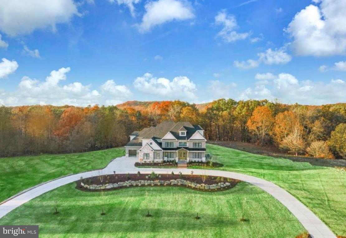 Oakwood by Eddy Homes – A Once-in-a-Lifetime Opportunity
Set within the coveted Unionville–Chadds Ford School District—just minutes from the everyday conveniences you desire, this custom home sits on a 3.2-acre private estate offering both serenity and accessibility.
Step into this luxurious custom home through a grand foyer with soaring ceilings, leading to a great room featuring a majestic stone fireplace & expansive window wall that frames breathtaking views of your 3.2-acre estate. Entertain in style with a formal dining room and private study, while the chef’s kitchen, a masterpiece of design, dazzles with dual 10’ islands, quartz countertops, butler’s pantry & upscale finishes that elevate everyday living.
Owner’s suite is an unparalleled retreat, offering a private balcony, 2 oversized closets & spa-inspired bathroom with premium design. Upstairs secondary bedrooms are thoughtfully designed with ample closet space, while the finished 3rd floor provides an elegant private suite. A 3-car side-entry garage and spacious mudroom ensure everyday convenience.
The walkout basement boasts a bedroom, full bath & a theater room, with direct access to the outdoors. Step outside to an expansive deck and wooded backdrop—perfect for both quiet mornings and lively gatherings.
Located just minutes from West Chester and Concordville, enjoy boutique shopping, top-rated dining, and year-round community events. With easy access to Route 202 and I-95, you’re a quick drive to Wilmington, DE, and only 30 miles from Center City Philadelphia. Nearby attractions include Longwood Gardens, local wineries, and premier golf courses.
Don’t miss this extraordinary opportunity. Schedule your private site tour today and claim your dream before it’s gone! This is your last chance to own a custom Eddy Home in Oakwood—where exclusivity meets natural beauty.