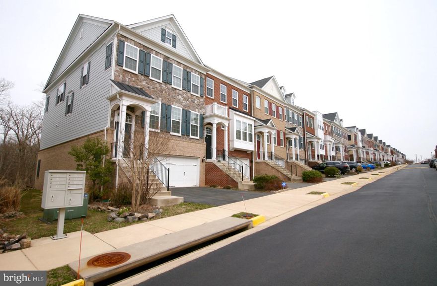 Move in into this beautiful end-unit townhome with expansive living space, feels like single family home. Open floor plan with hardwood floors and tile. Dedicated formal living spaces and family living areas. Additional sunroom from the kitchen backs to woods. Master suite with tray ceiling and lots of natural light. Finished basement suite with bedroom and full bathroom, with additional recreational room. Two car garage with ample visitor parking. Move in 7/5.